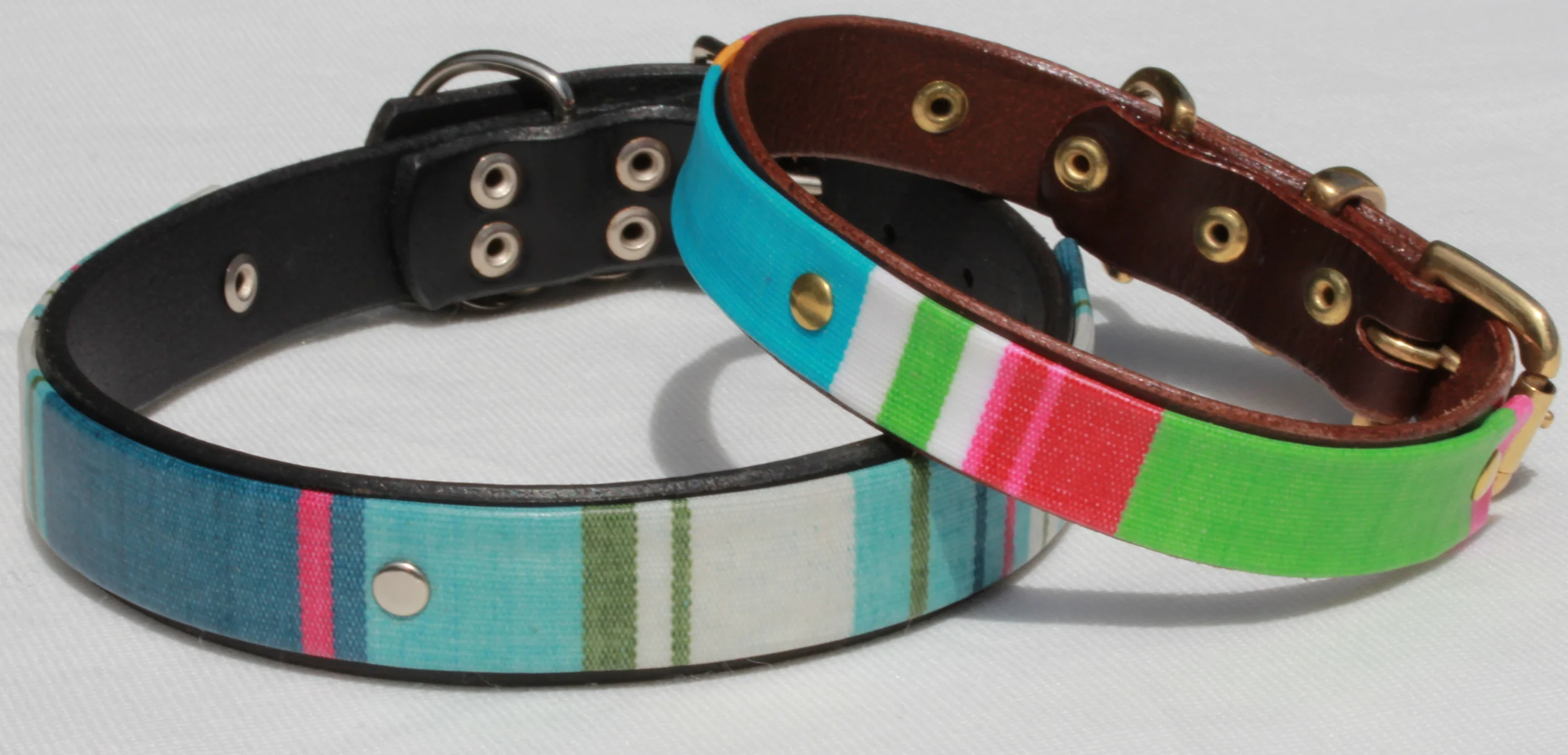 Blue stripe on black leather with nickel plated fittings, red green and blue stripe on brown leather with brass fittings