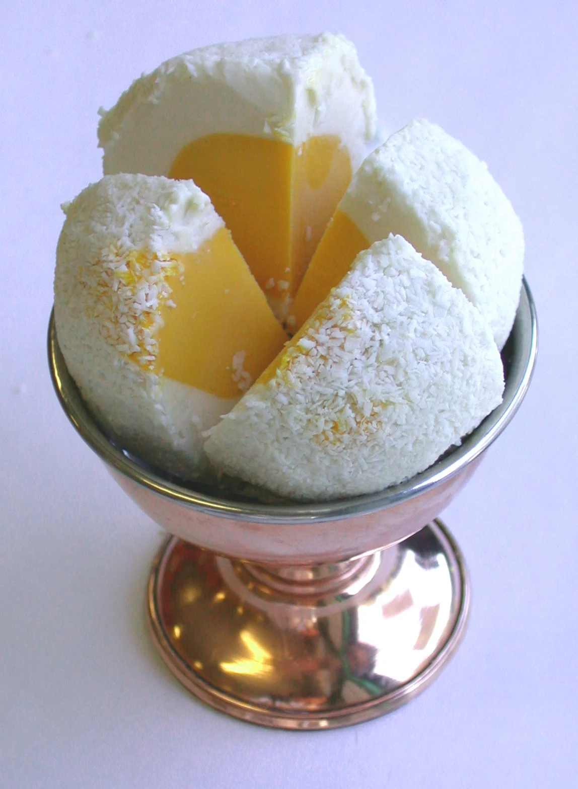 Mango Banana: Alfonso Mango sorbet centred in banana ice cream rolled in coconut.