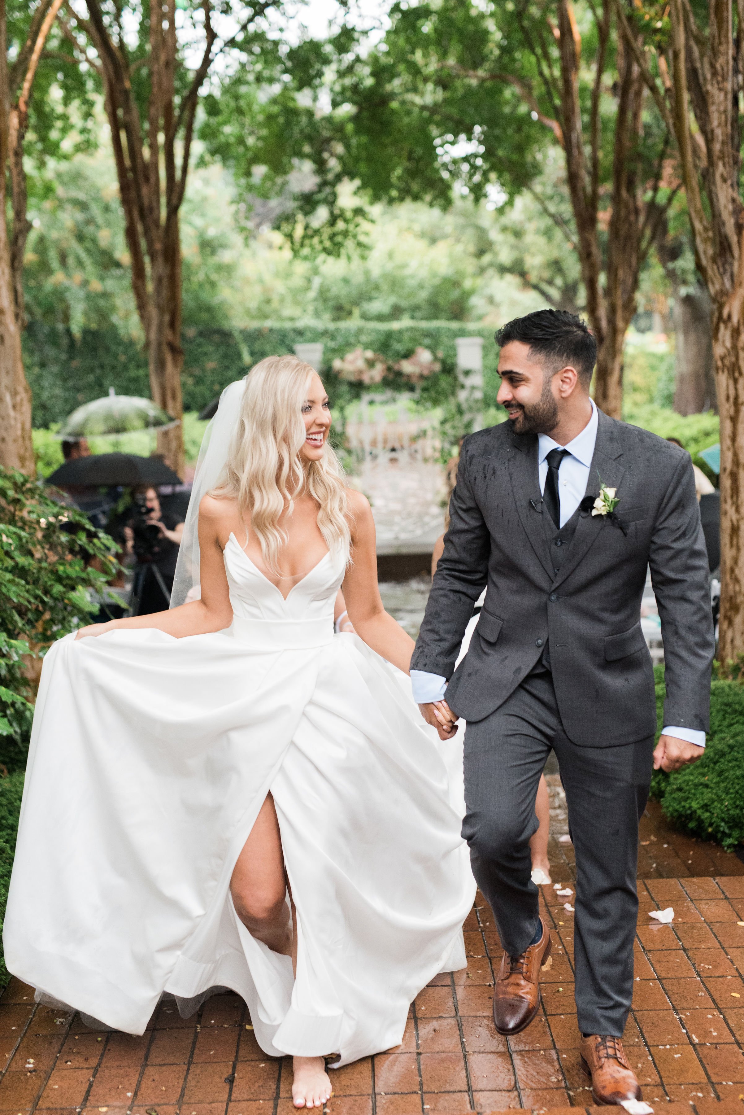 a garden rainy wedding day featuring quice an ines di santo ball gown