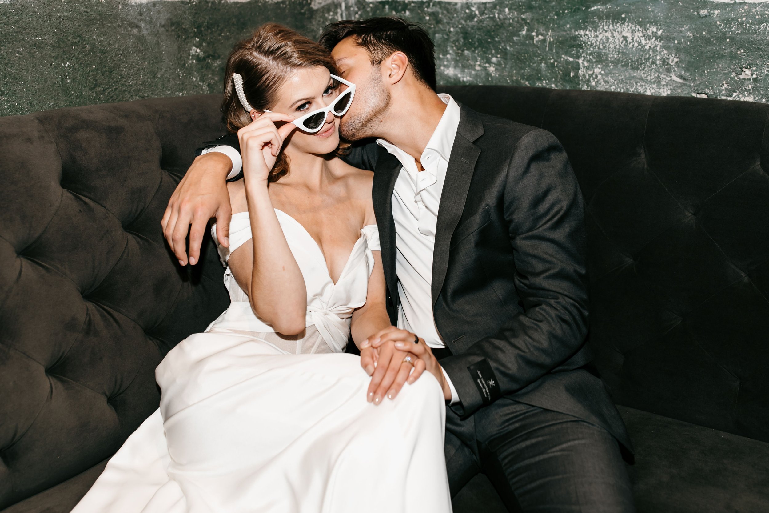 chic influenencer vibes wedding inspo featuring a katherine tash wedding dress and the bride wearing sunglasses