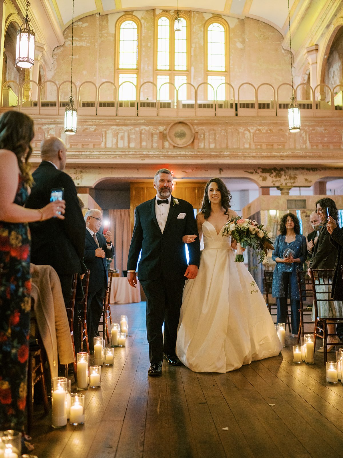 romantic candlelit wedding ceremony in a restored convent in new orleans.