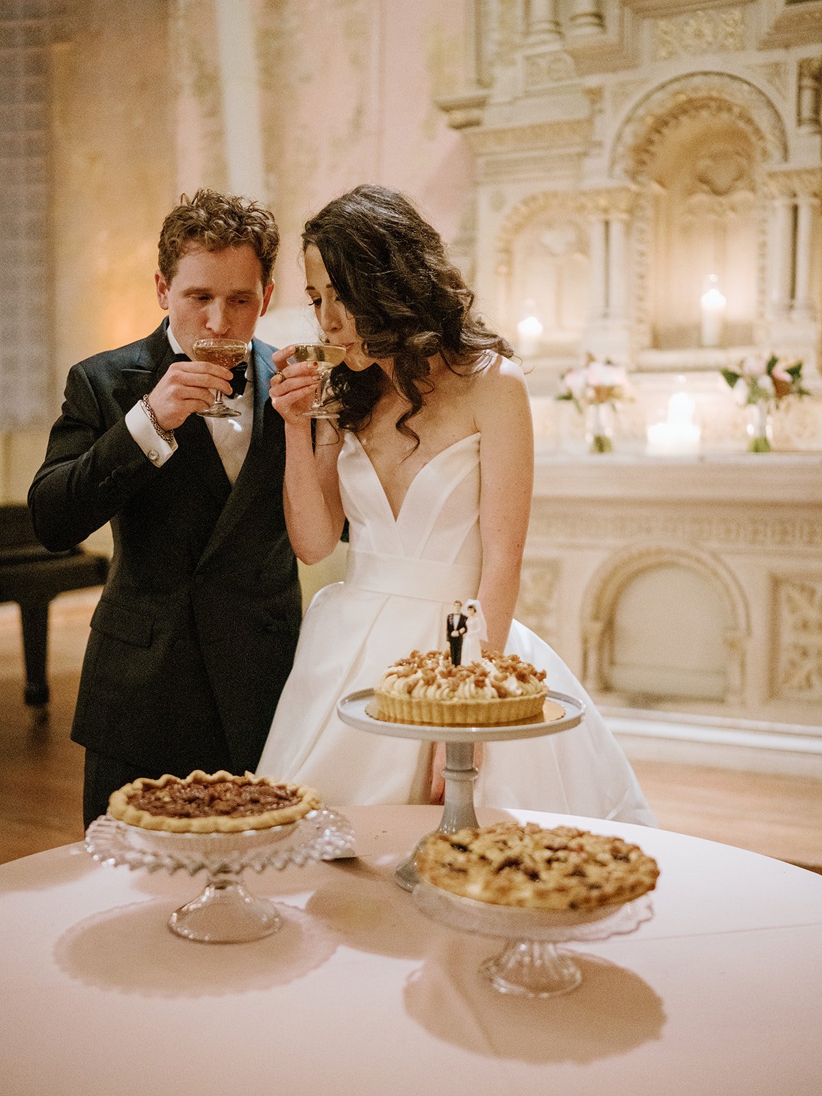 a new orleans wedding with pies instead of wedding cake in a candlelit romantic wedding reception.