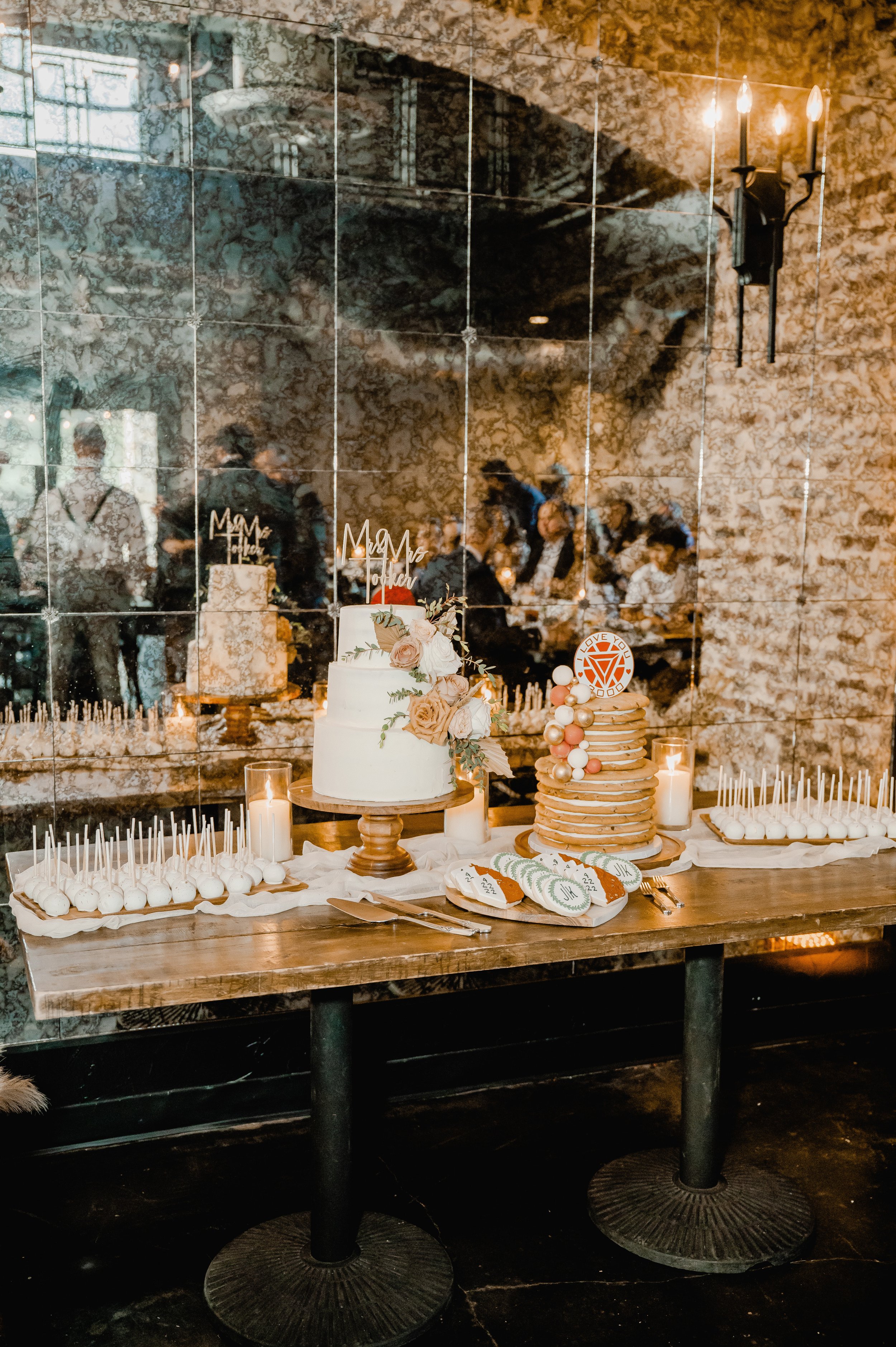 a rustic and classy dessert table with an assortment of desserts for this modern wedding in texas.