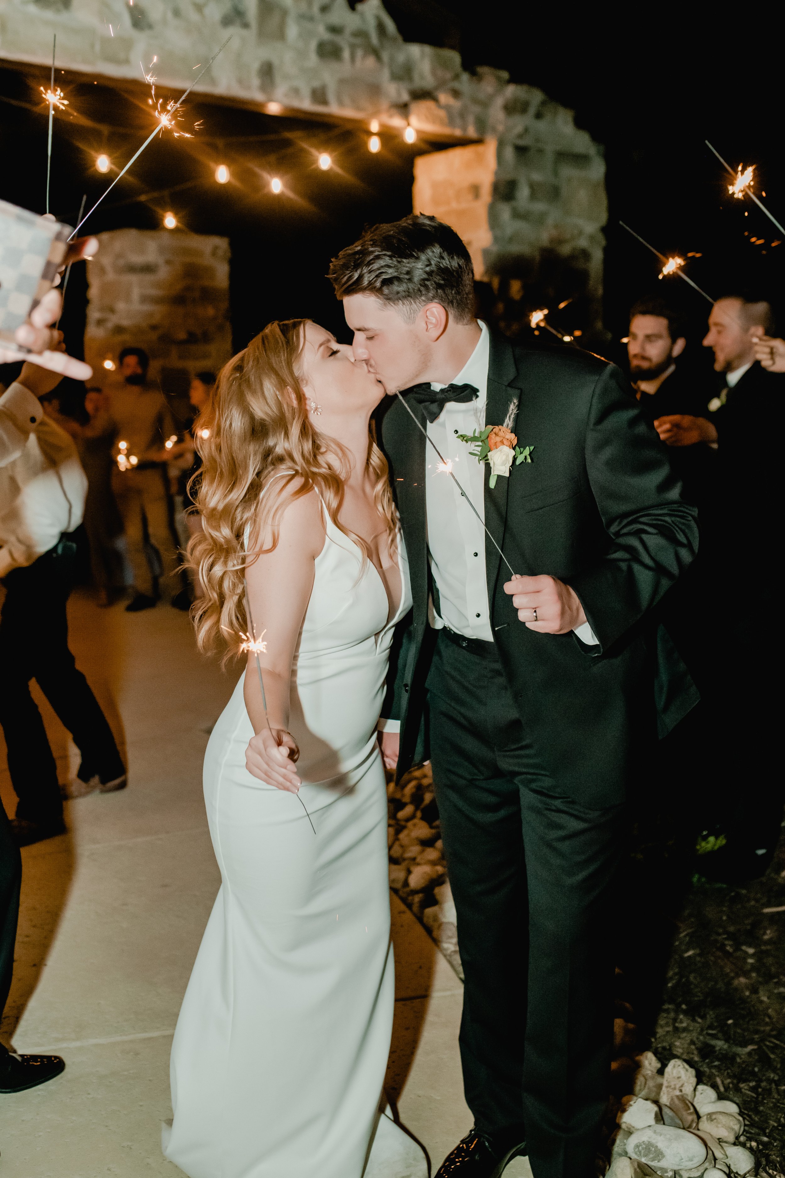 modern sparkler exit for this cool and chic texas wedding featuring the label wedding dress.