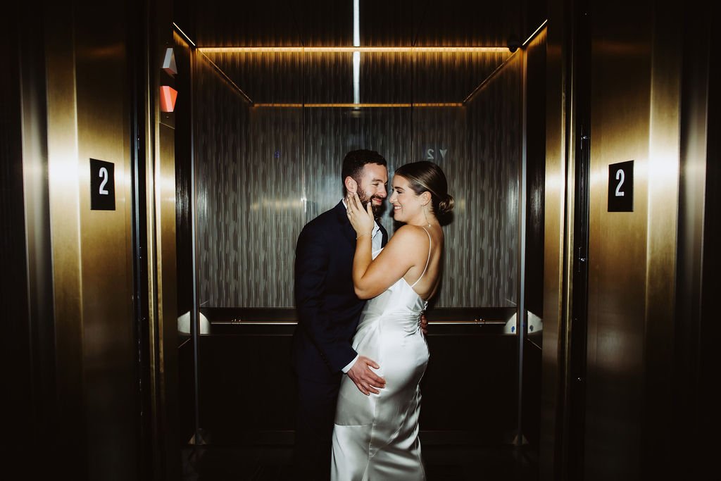 sexy bridal shoot in the elevator of the four seasons hotel wedding reception