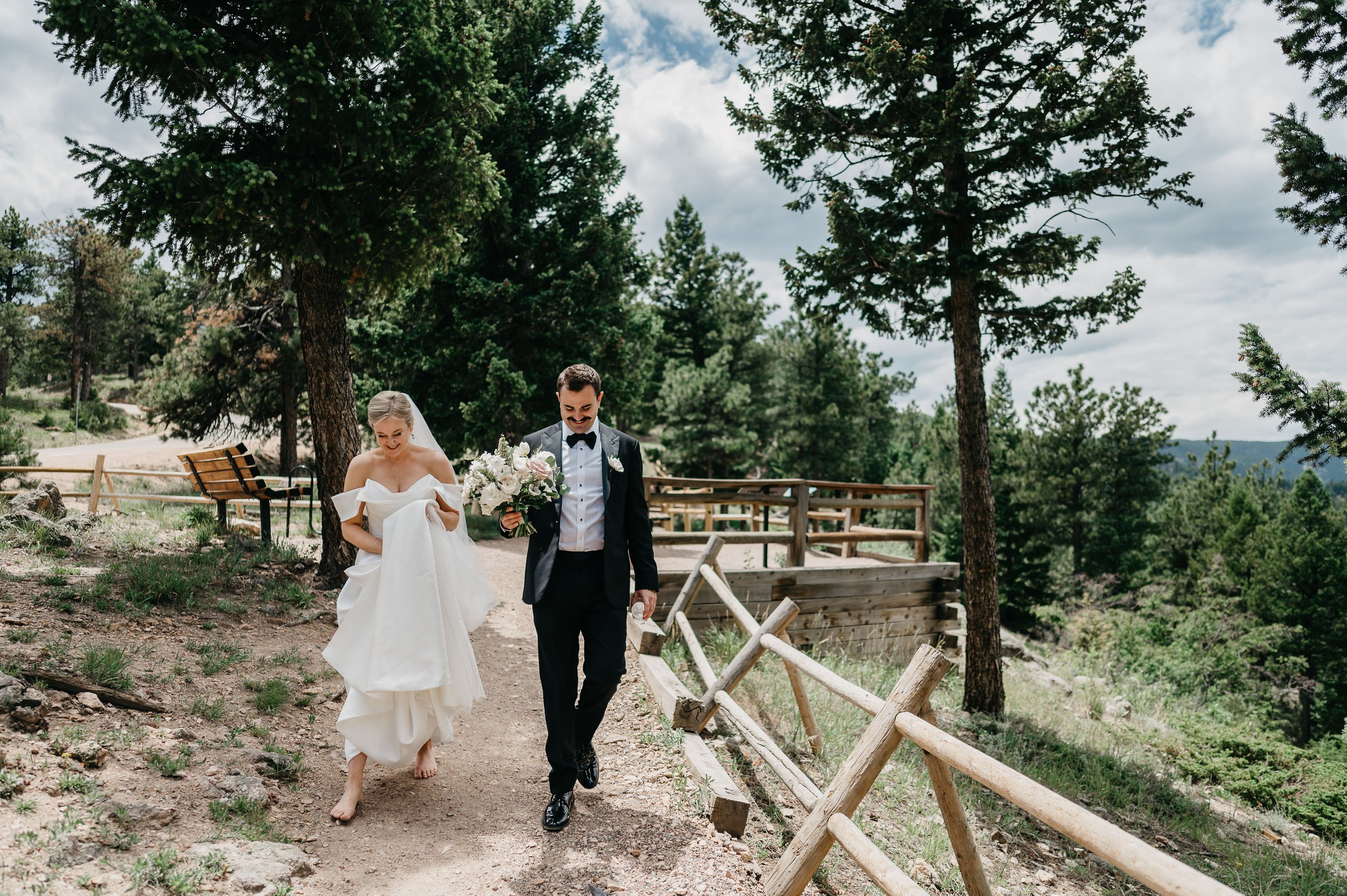 a mountain top view ceremony featuring a hera couture ball gown from anna be bridal boutique