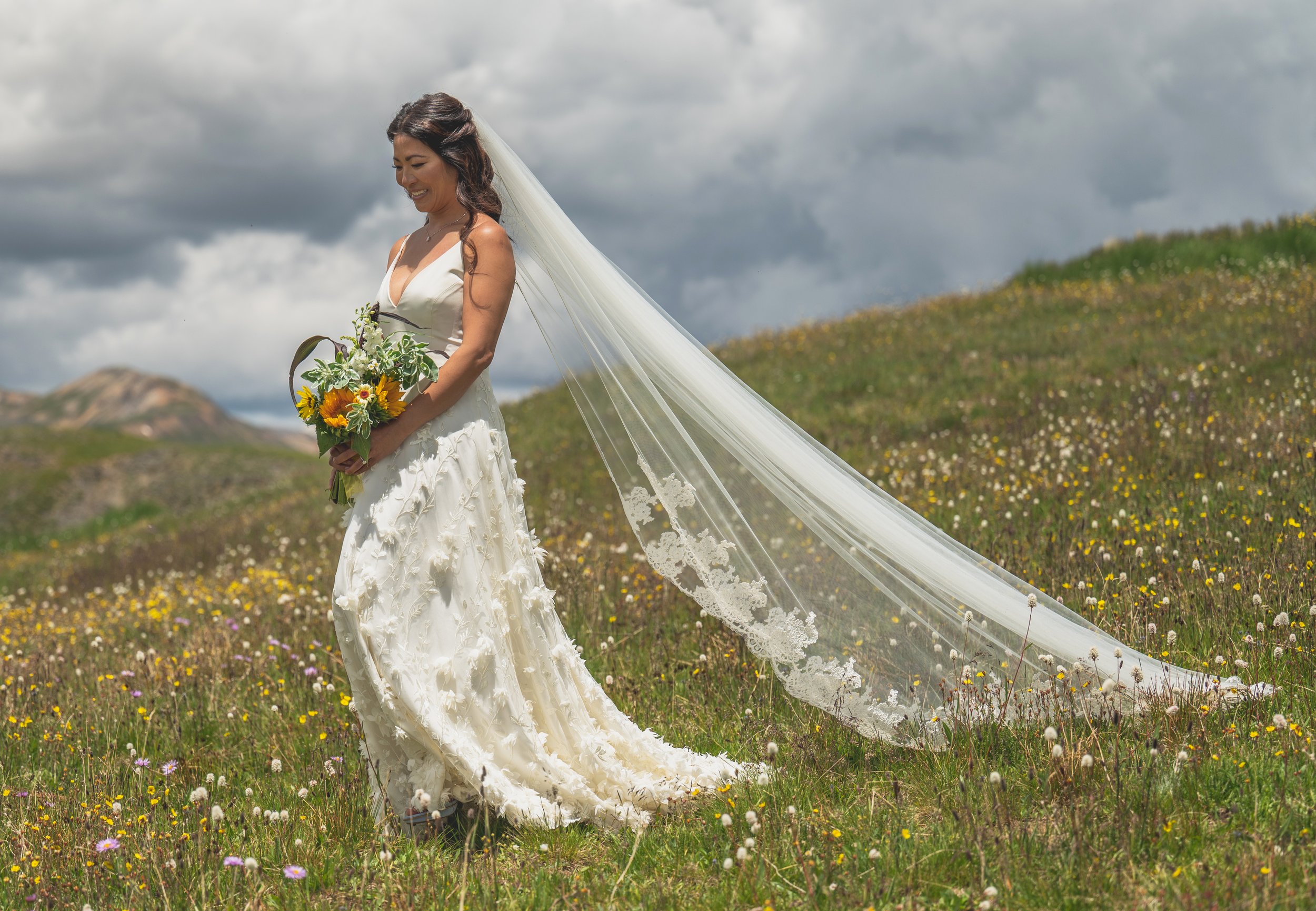 colorado micro wedding atop a mountain in a rebecca schoneveld wedding dress