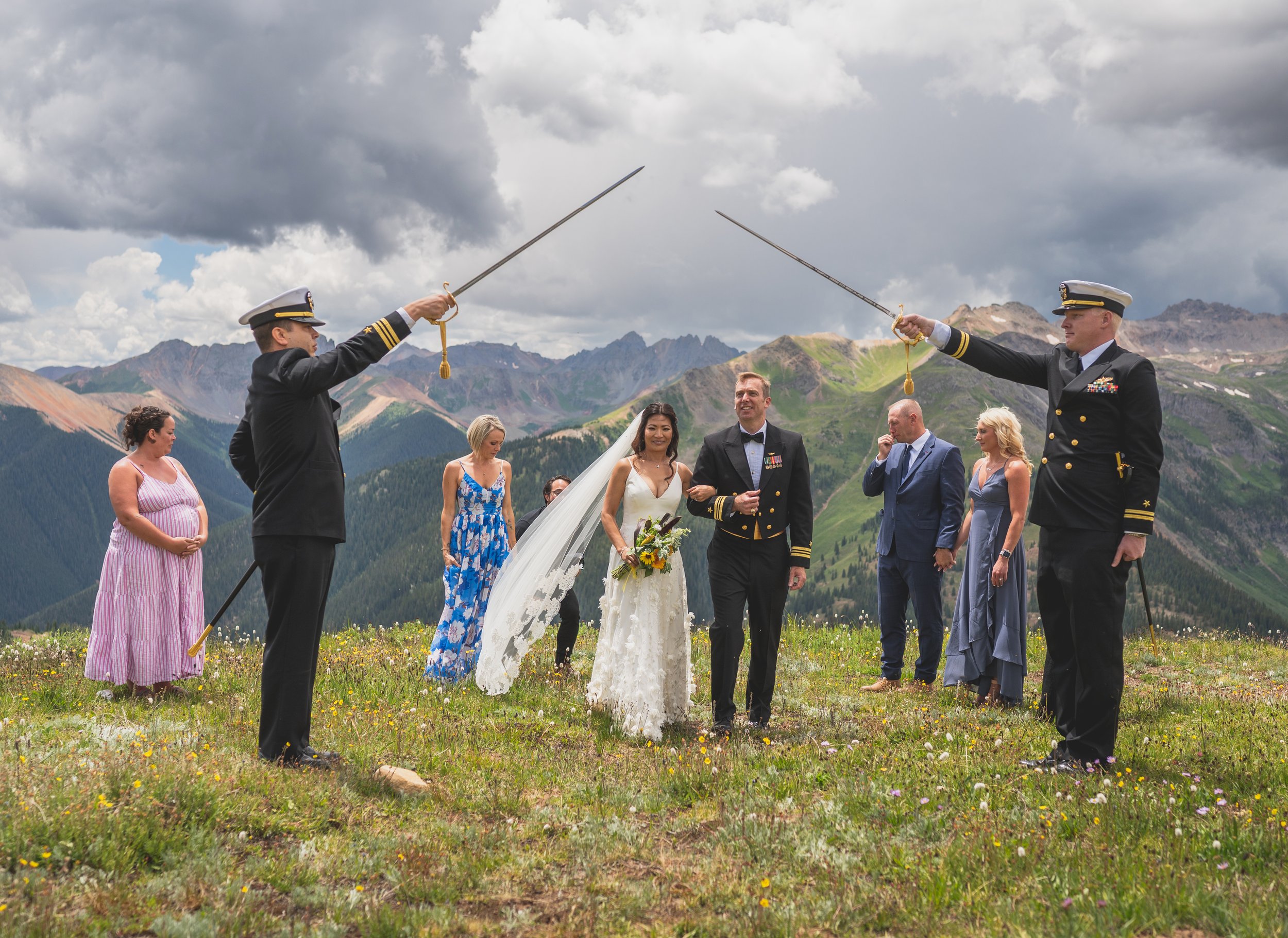 a military micro-wedding on a mountain in colorado featuring a rebecca schoneveld wedding dress