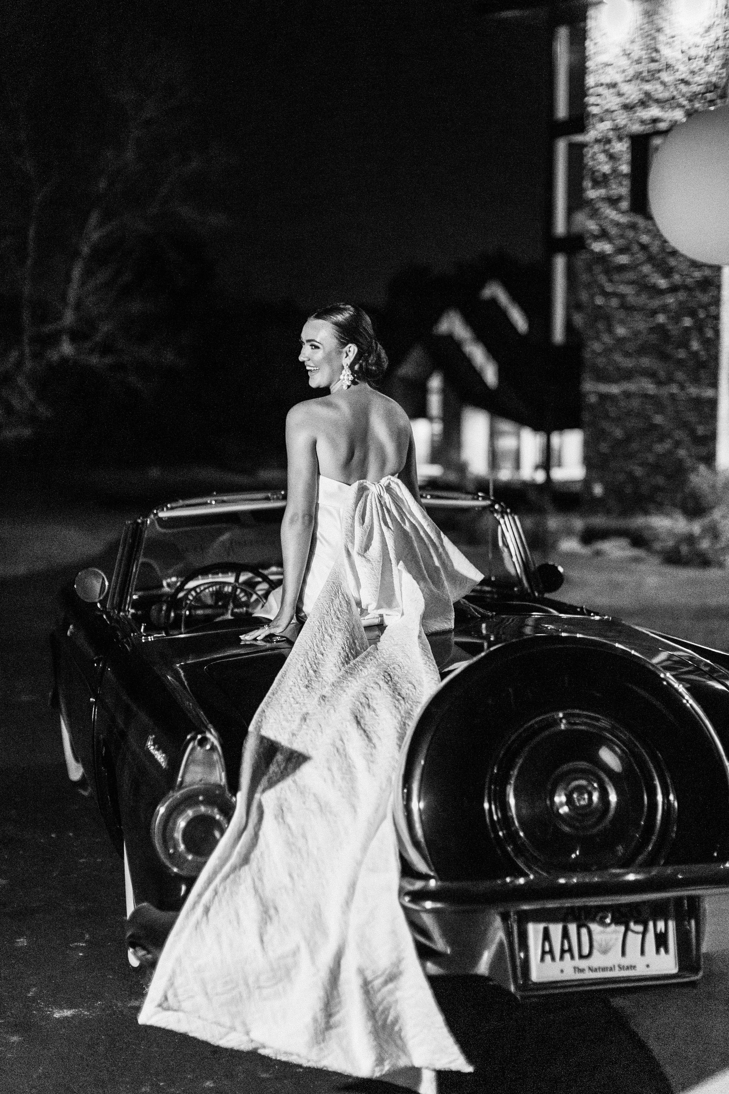 a classic getaway car at the end of this modern wedding reception in arkansas