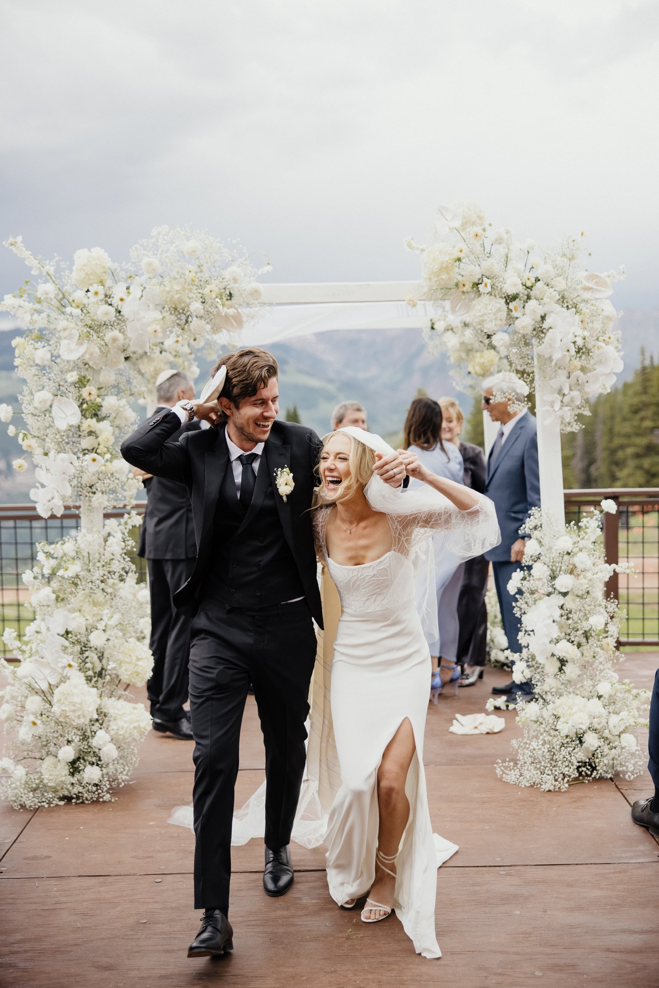 a modern outdoor jewish wedding ceremony featuring the bryn beaded wedding dress by alexandra grecco