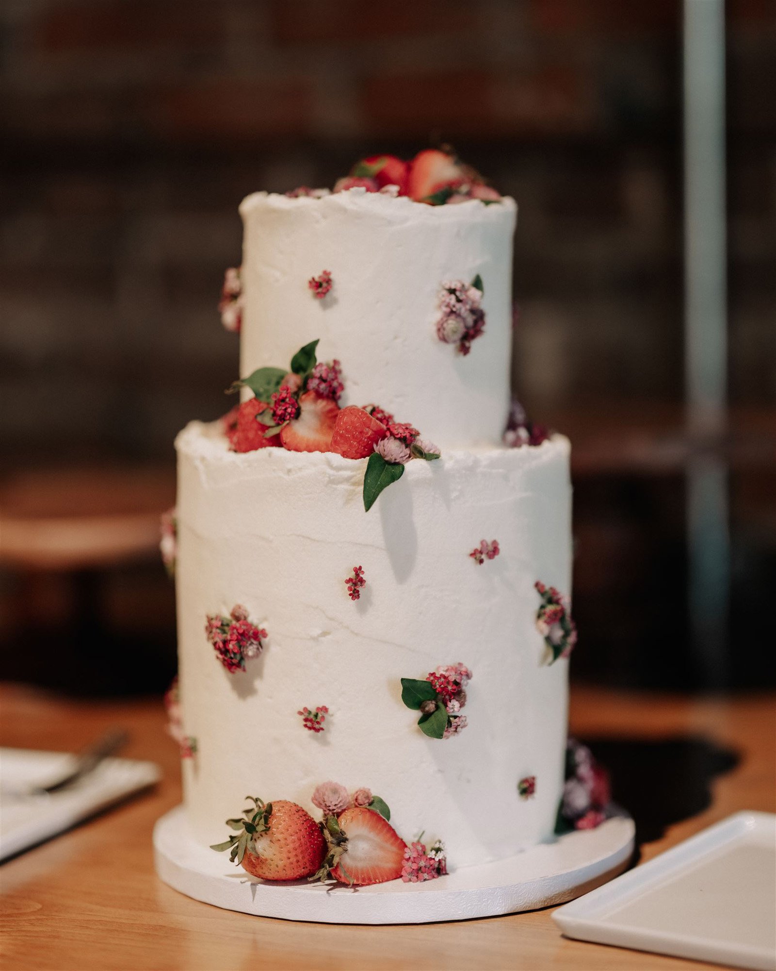 a unique strawberry wedding cake at this artful wedding in st. paul minnesota.