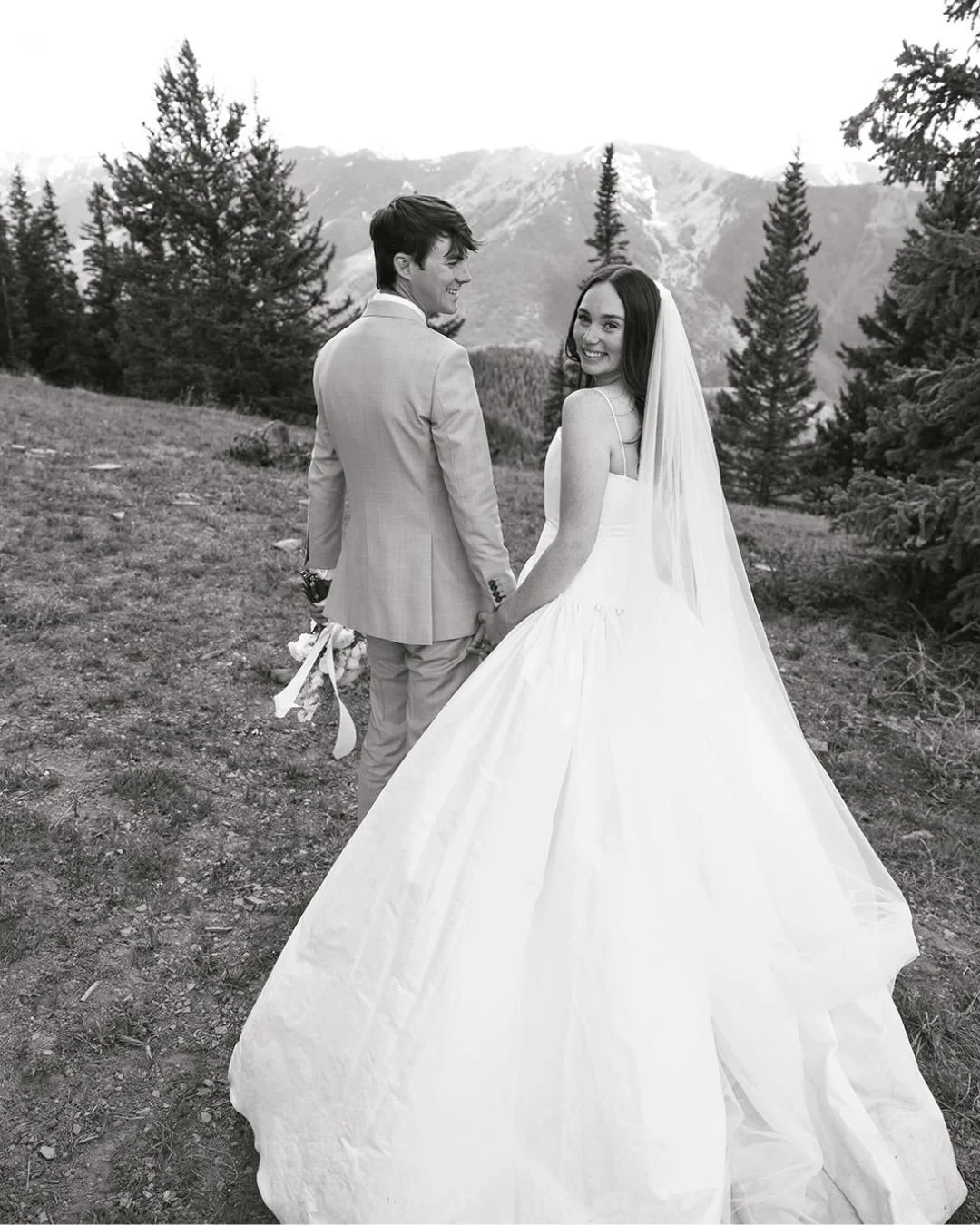 a big congratulations to anna b&eacute; colorado bride lauren + drew 🥂

lauren wore charli by alexandra grecco for the couples beautiful mountain wedding. 🕊️

dress | charli by @alexandragrecco via anna b&eacute; bridal boutique colorado
photograph