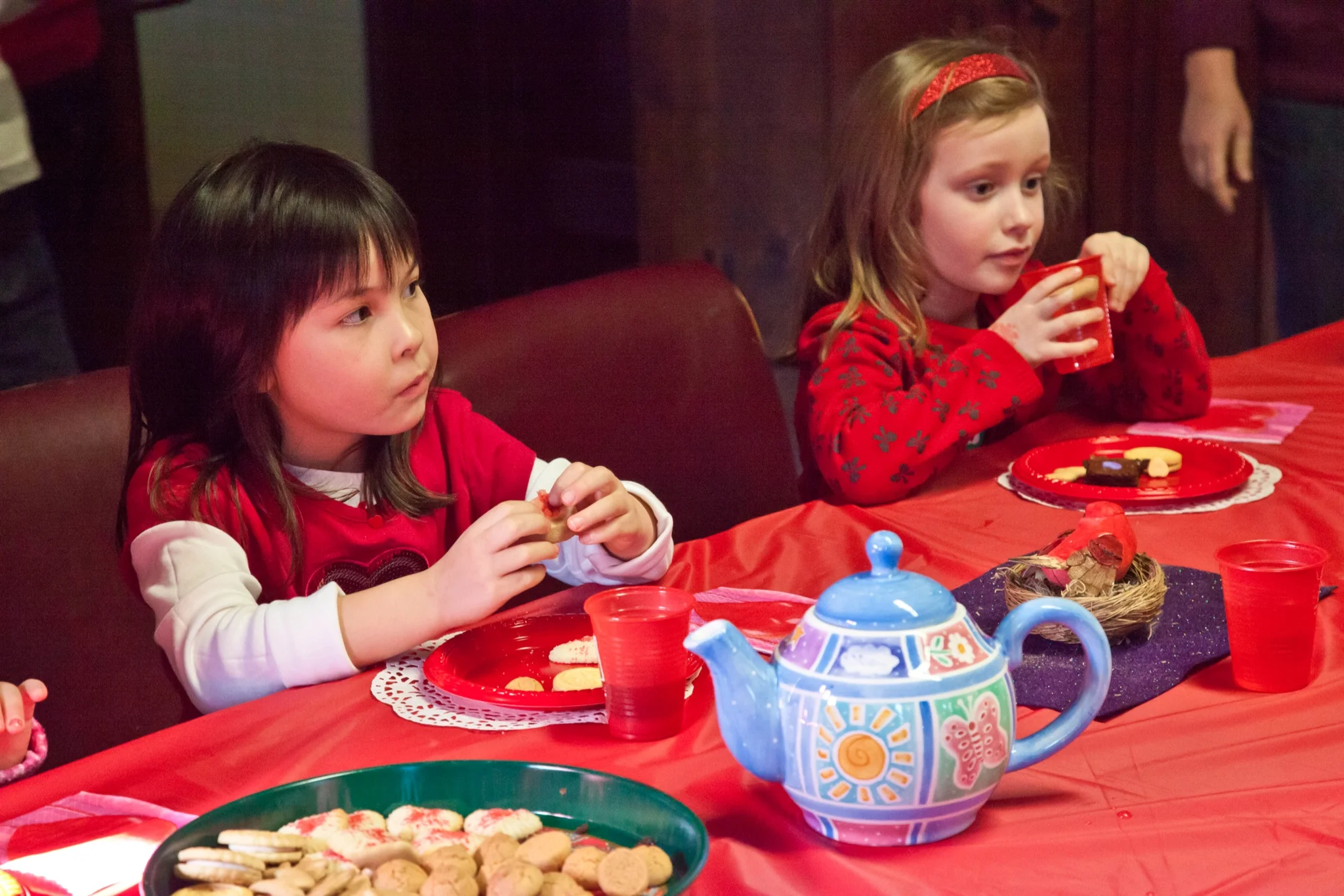 Children enjoying cookies during a young learners program