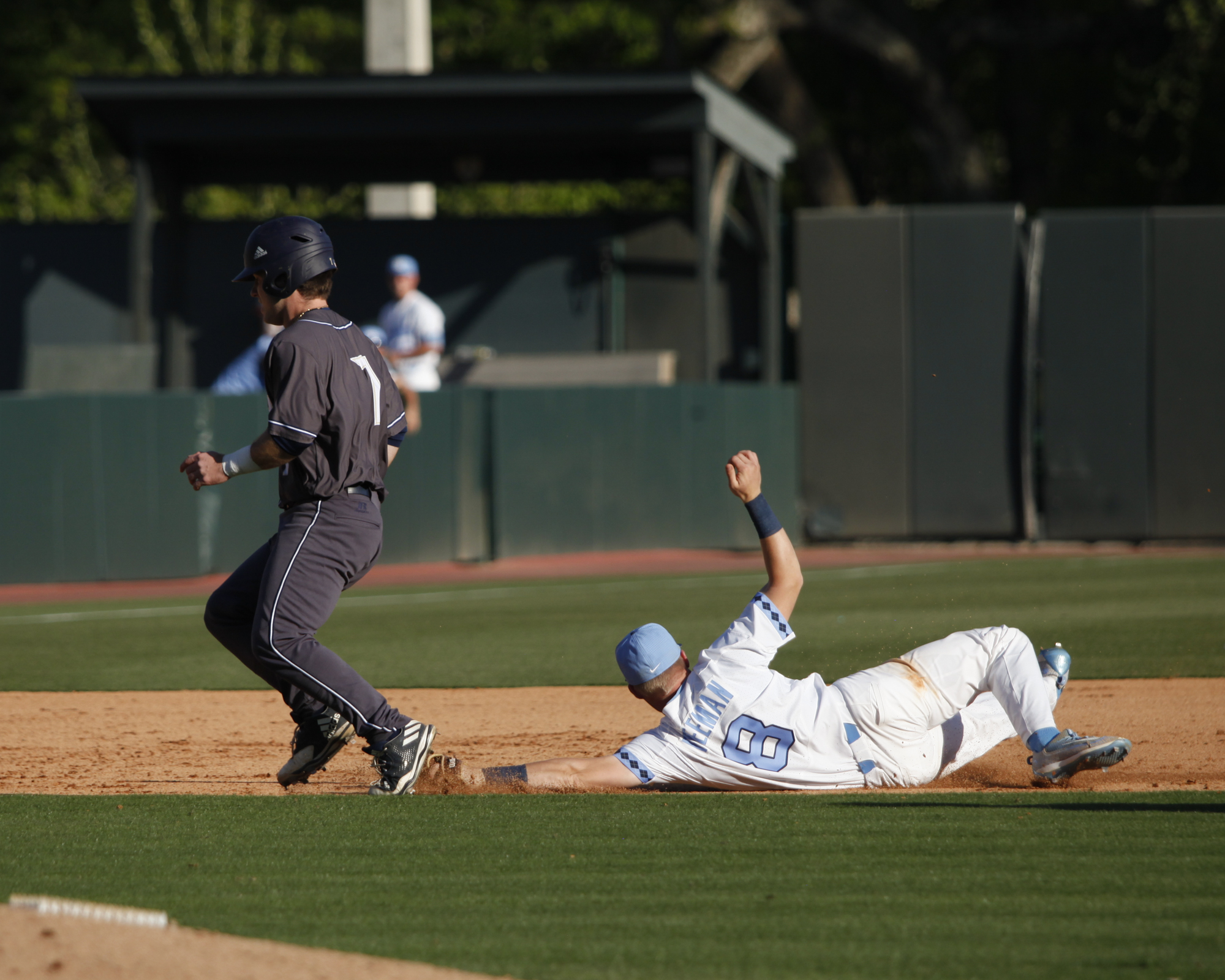 UNC shortstop, Ike Freeman, dives to get the out during a pickle play between second and third base at Boshamer Stadium.
