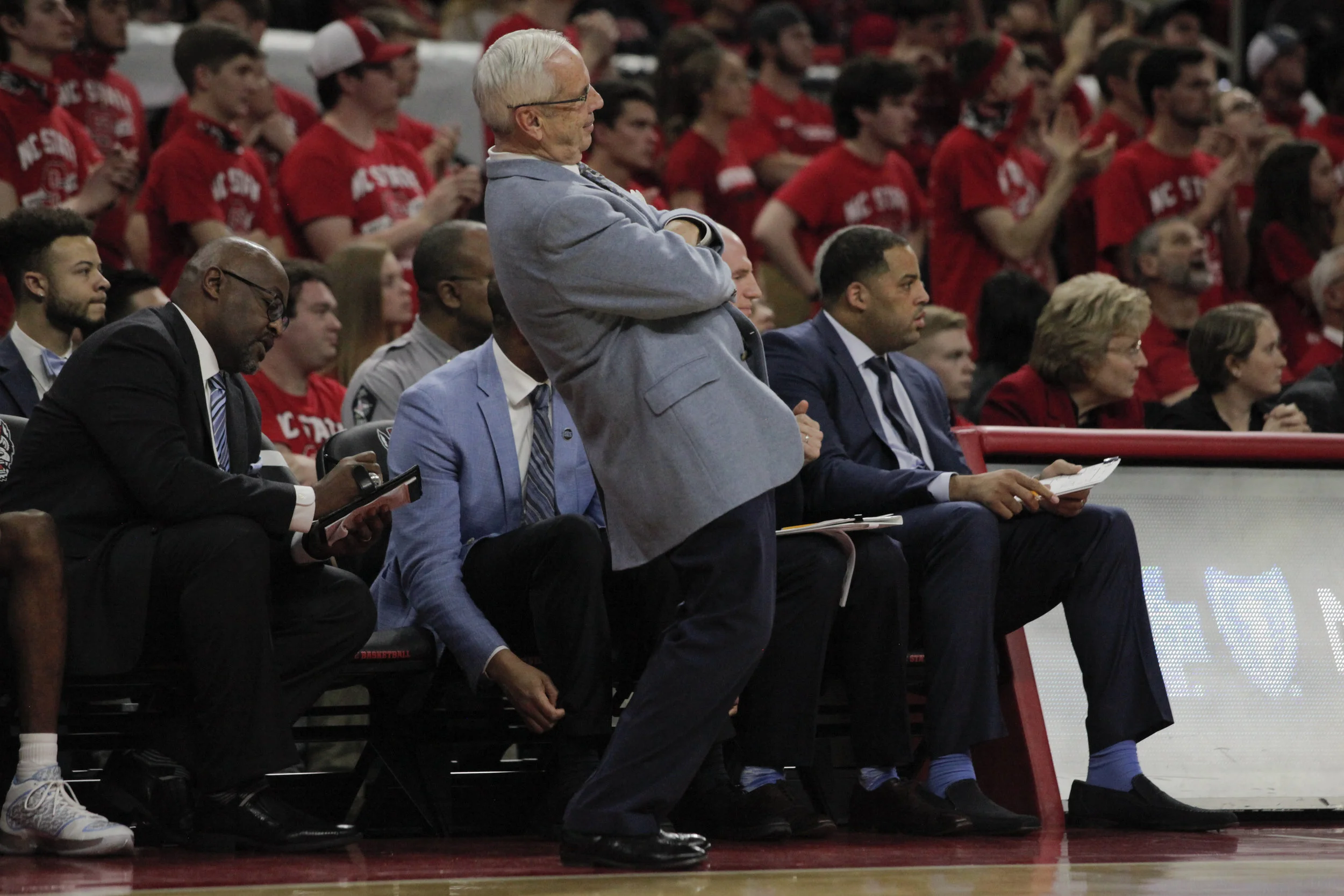 UNC head coach Roy Williams leans back after Theo Pinson misses a free throw during the UNC vs. NC State game at PNC Arena.