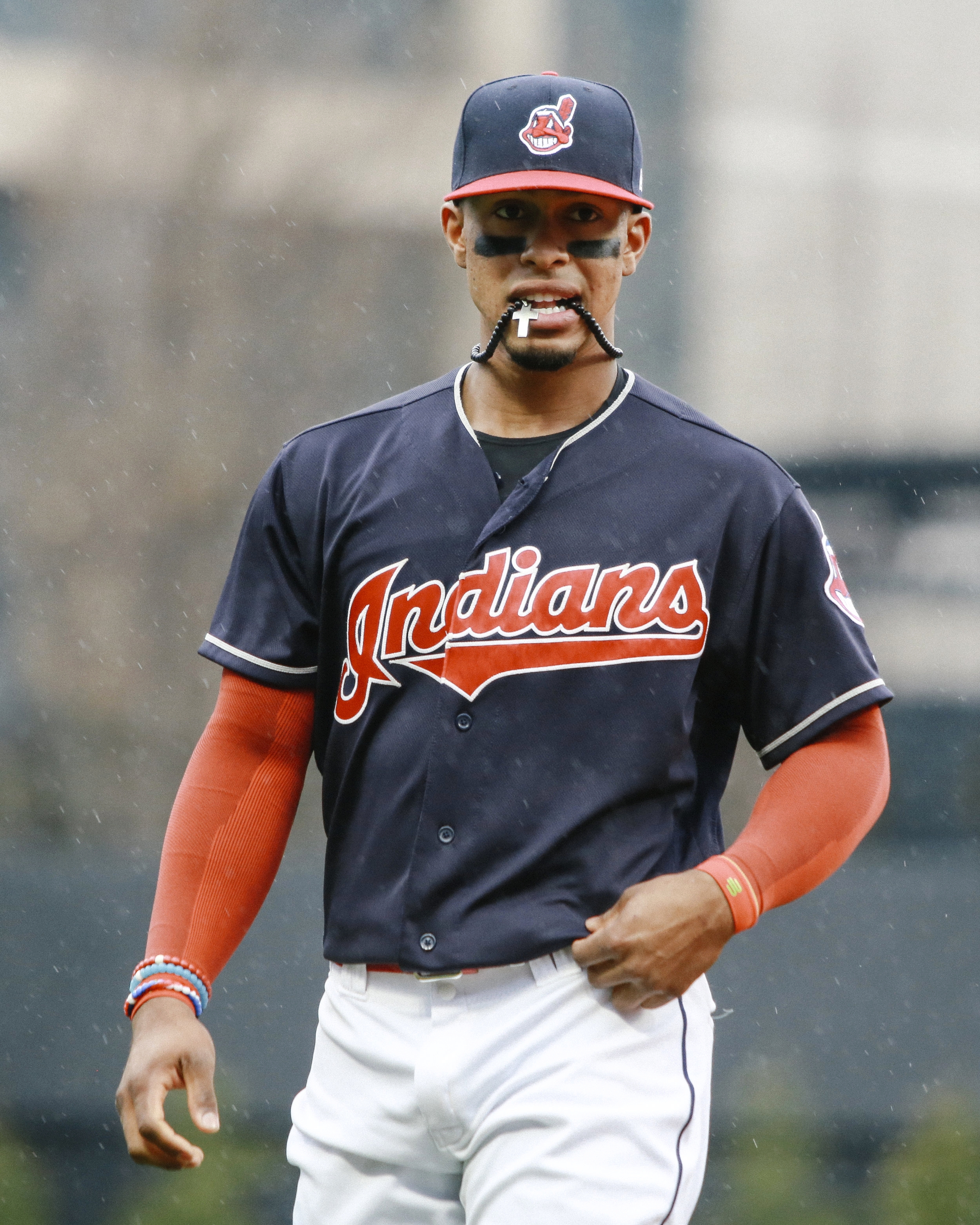 Indians baseball player, Francisco Lindor, plays with his necklace before a game at Progressive Field.