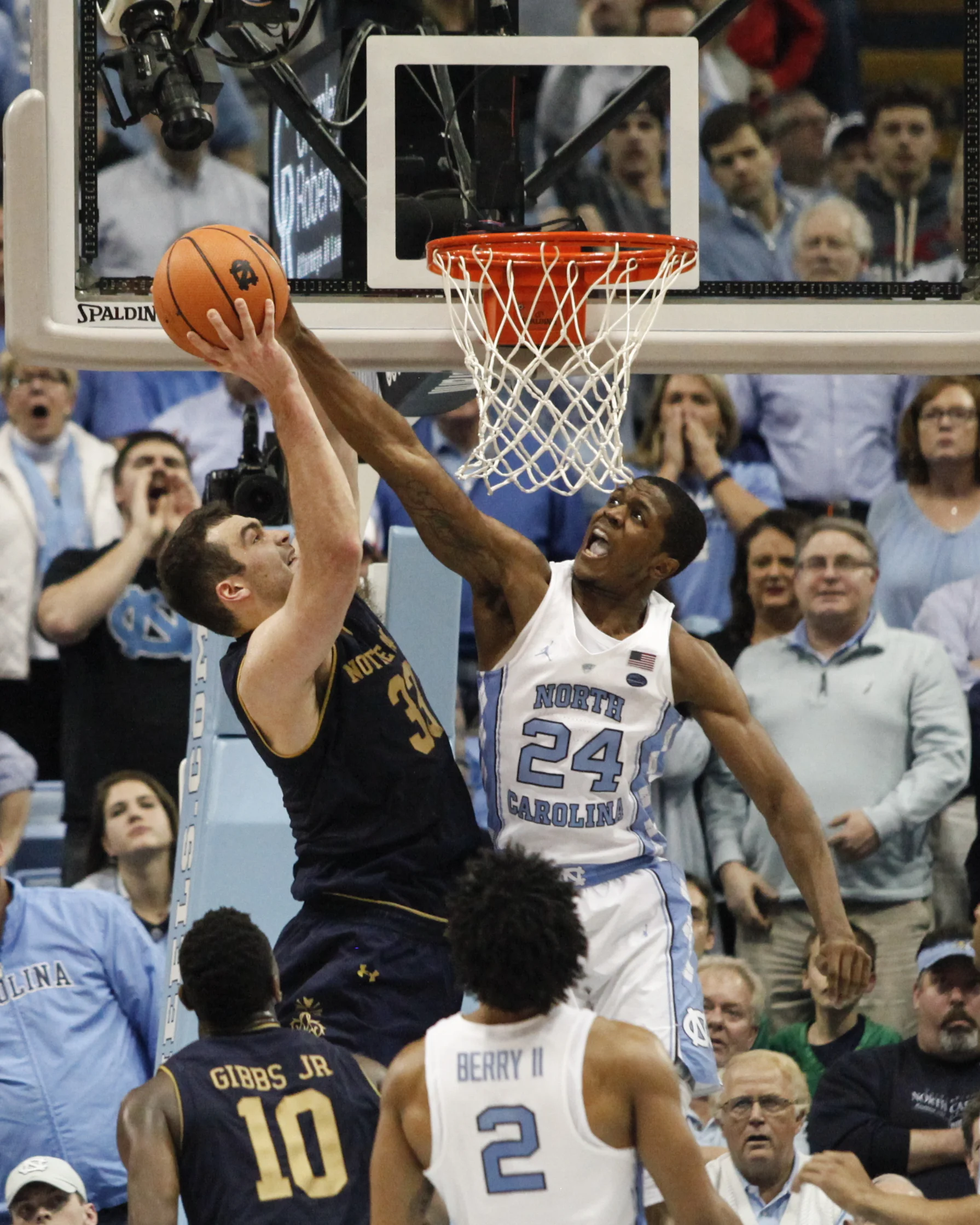 UNC guard, Kenny Williams, blocks Notre Dame forward John Mooney during the regular season at the Dean Smith Center.