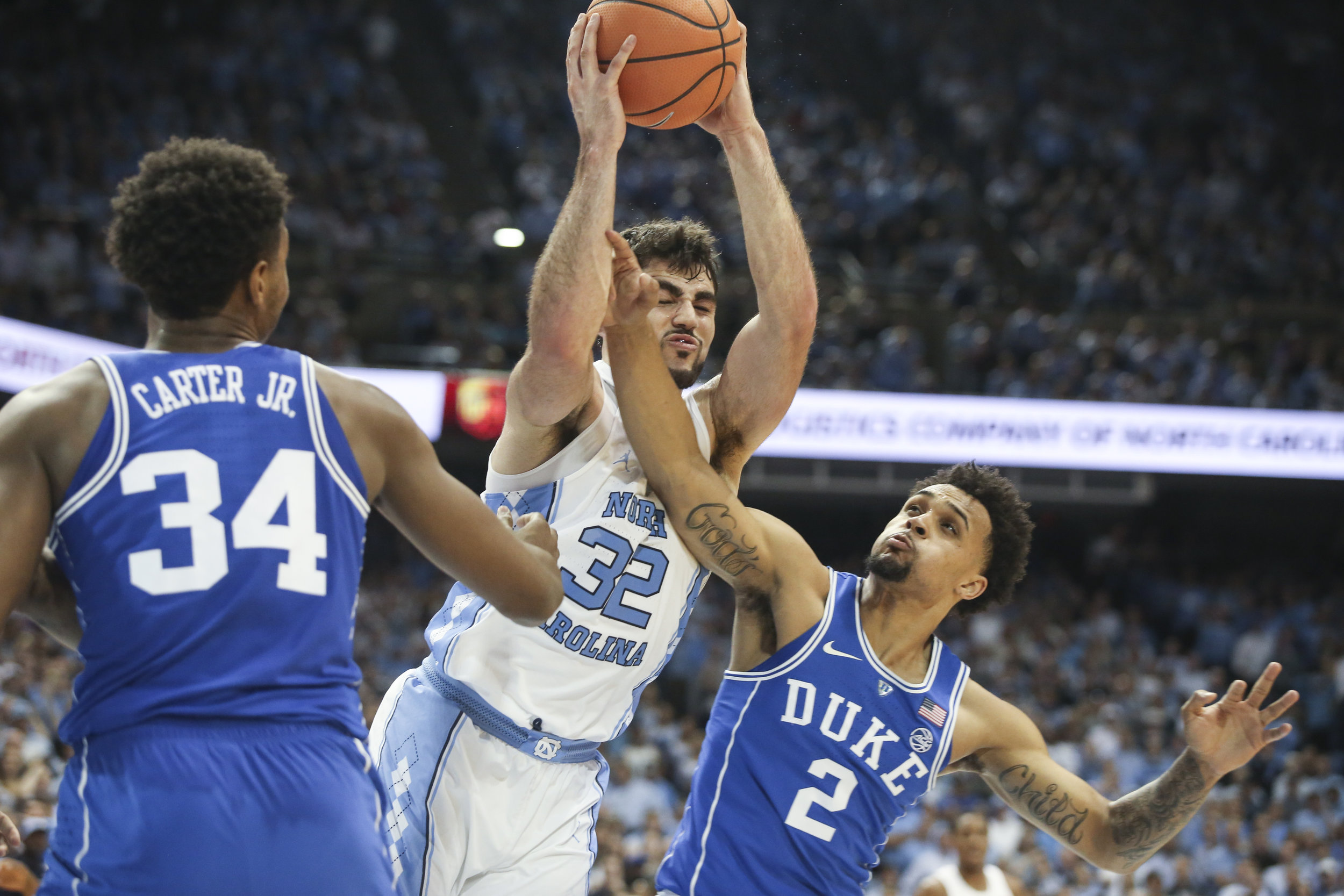 UNC’s Luke Maye is fouled by Duke’s Tre Duval during the game at Dean Smith Center.