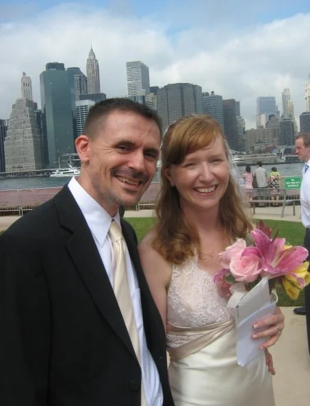 My wife and I, with the East River in the background