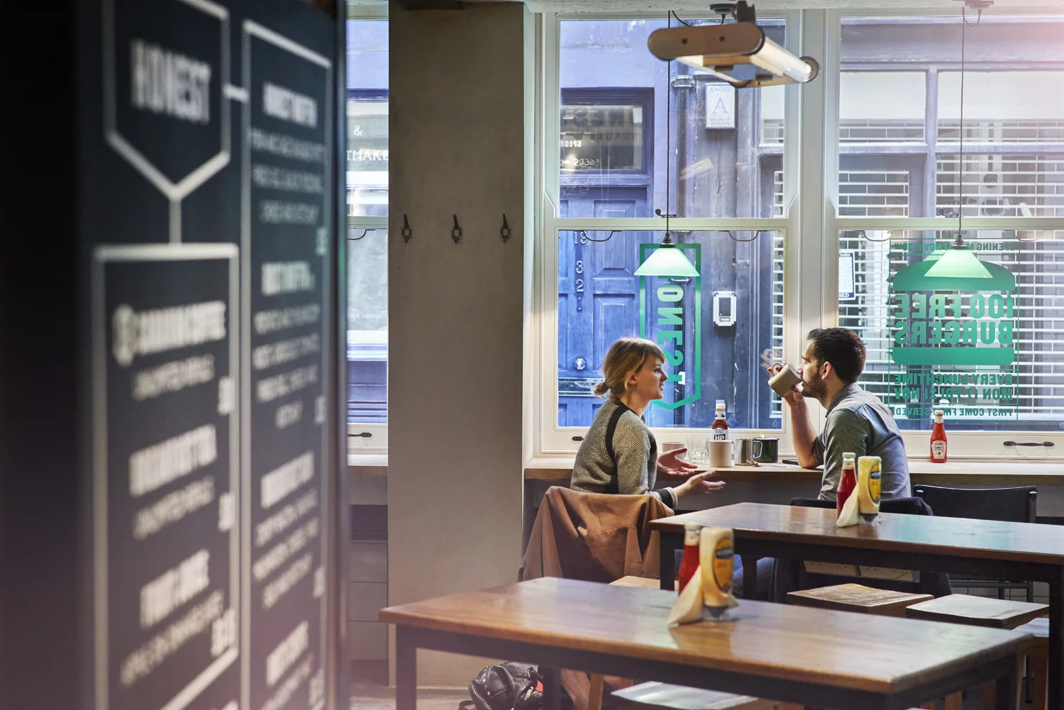 Couple drinking coffee and having breakfast at Honest Burger's new location in Liverpool Street. Imagery and Photography by London based still life and food photographer Scott Grummett. 