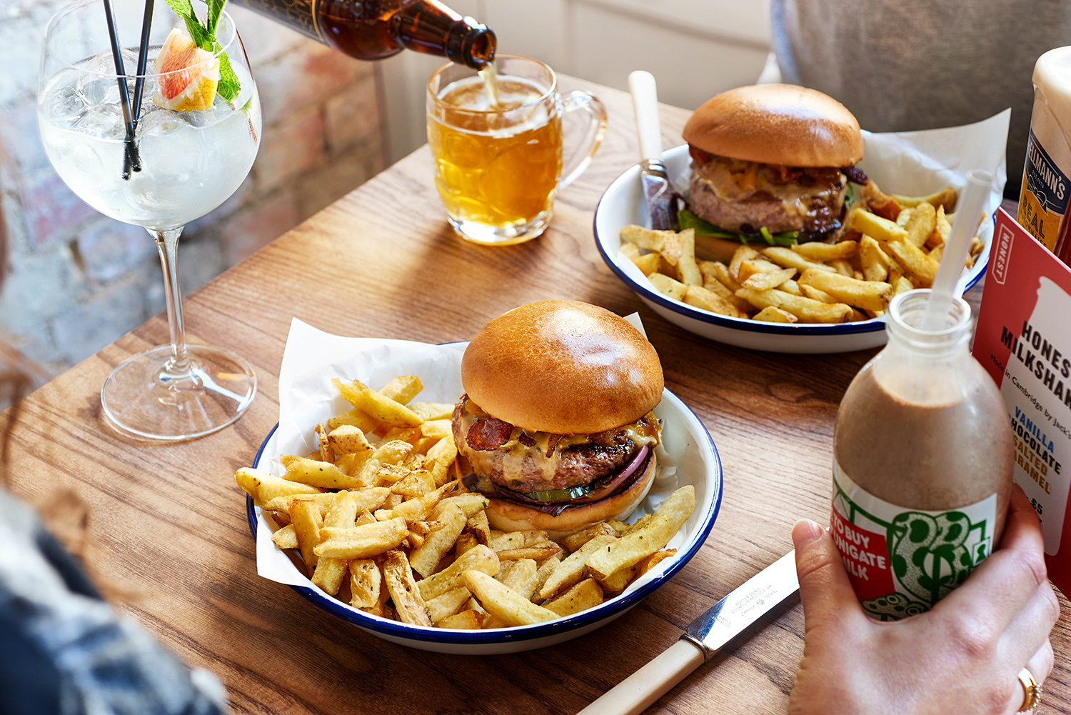 Diners enjoying the Burgers & Drinks at Honest Burgers Cambridge.
