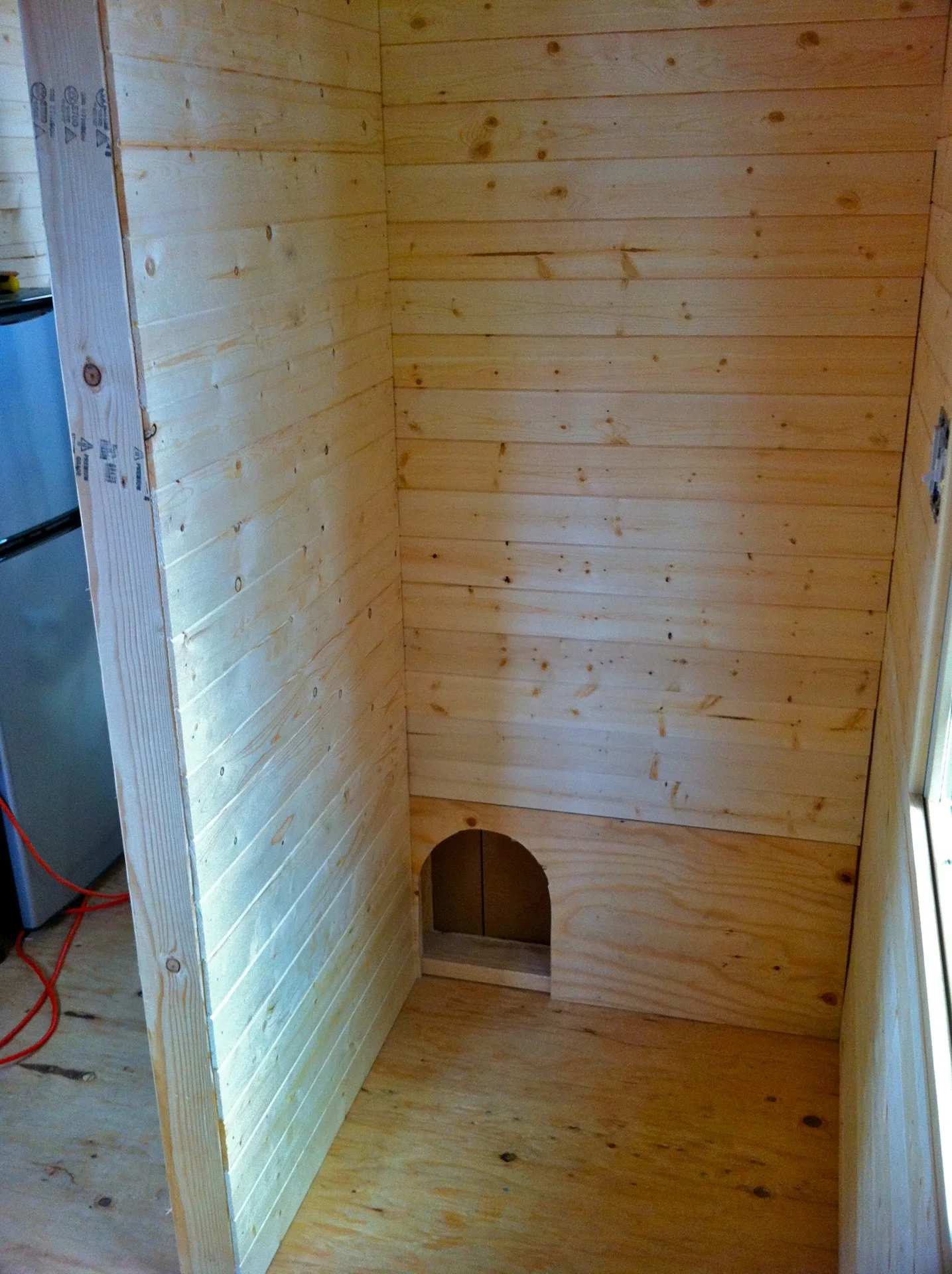 Day seventy- This will be the end of the bathroom where the toilet will go. We included a little access point for the kitties to get into the cabinet where their litter box will be placed.