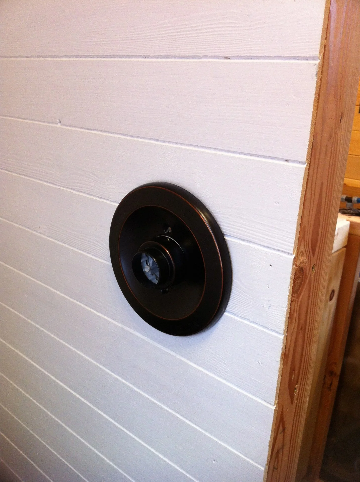 The other side of the wall where the shower hook up is.