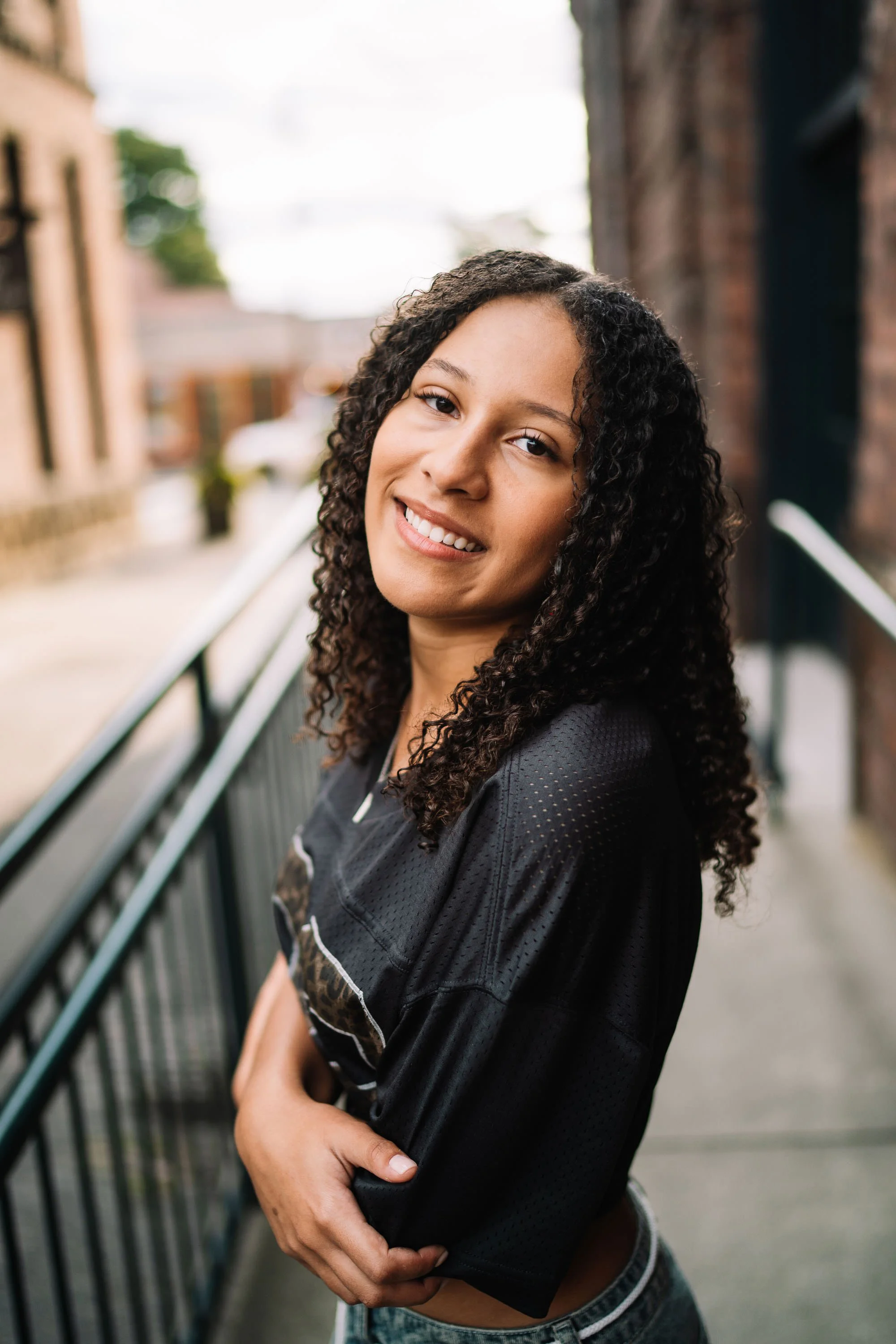 Senior girl standing confidently in gritty urban setting Georgetown Seattle