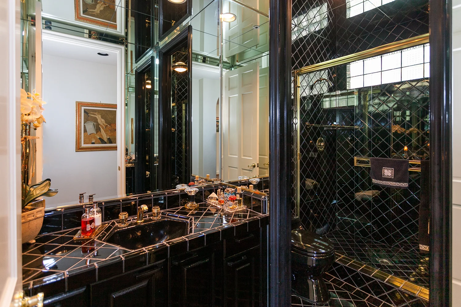 We love this black and gold bathroom!