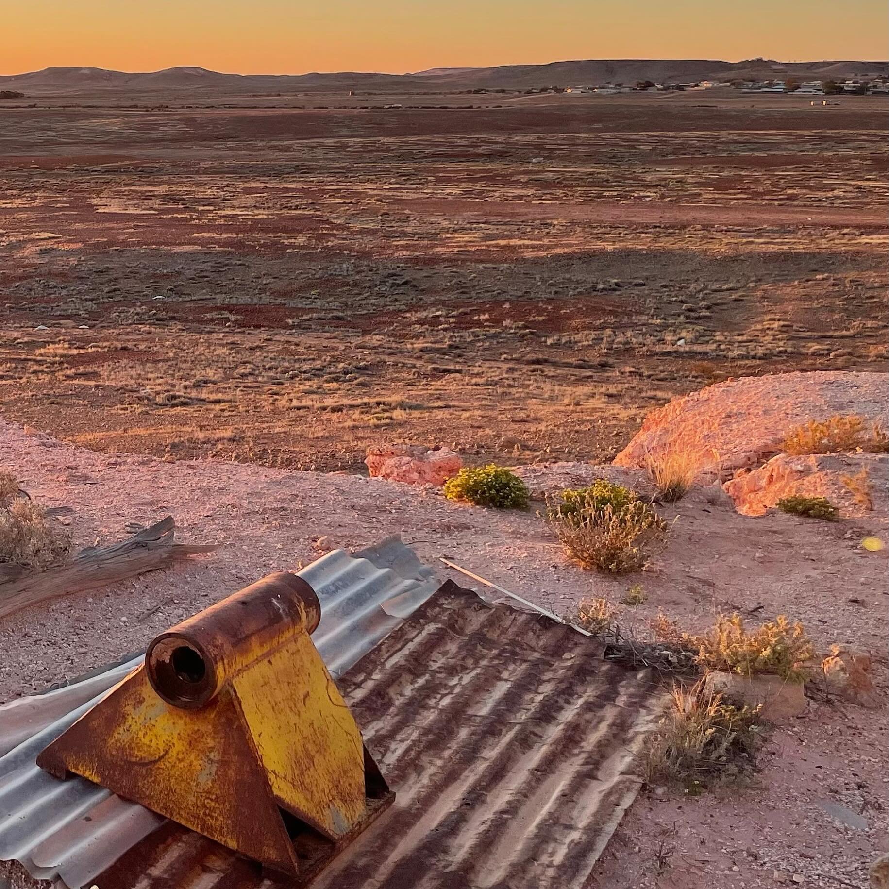 Colours of rust. Looking out from Coober Pedy, Thursday 28 July 2022 at 07:22 am. Traveling Australia by car and thinking about distance, value, and materials.