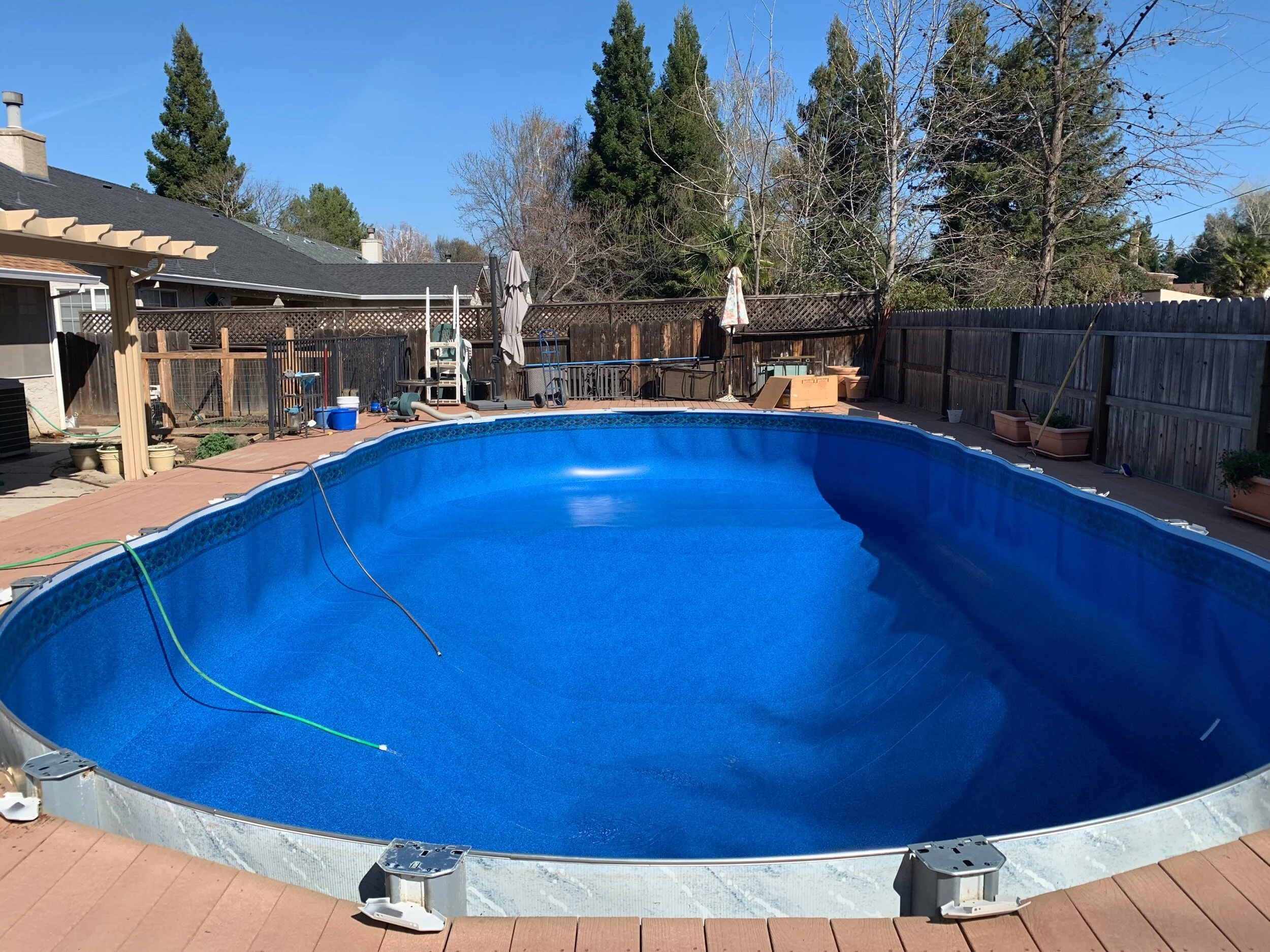 New custom made liner vacuumed into position then filled by a water truck.