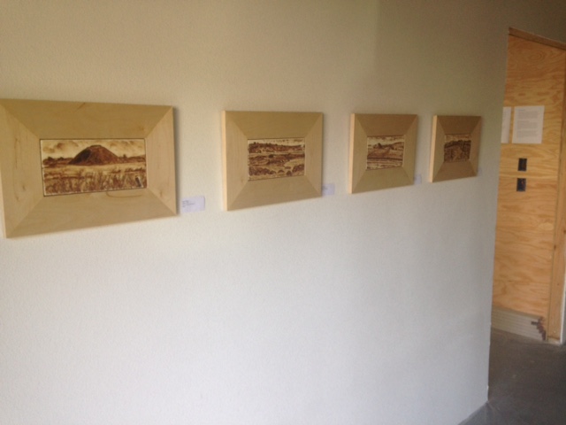 View of shared hallway in new studio with my walnut ink painting series.