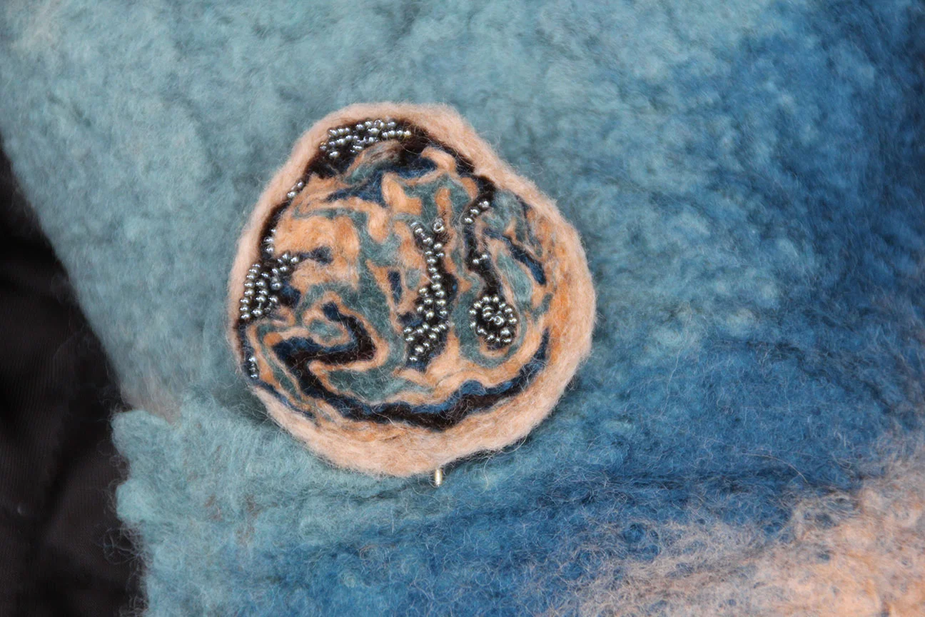 Felt stick pin. Wet felted and bead appliquéd.