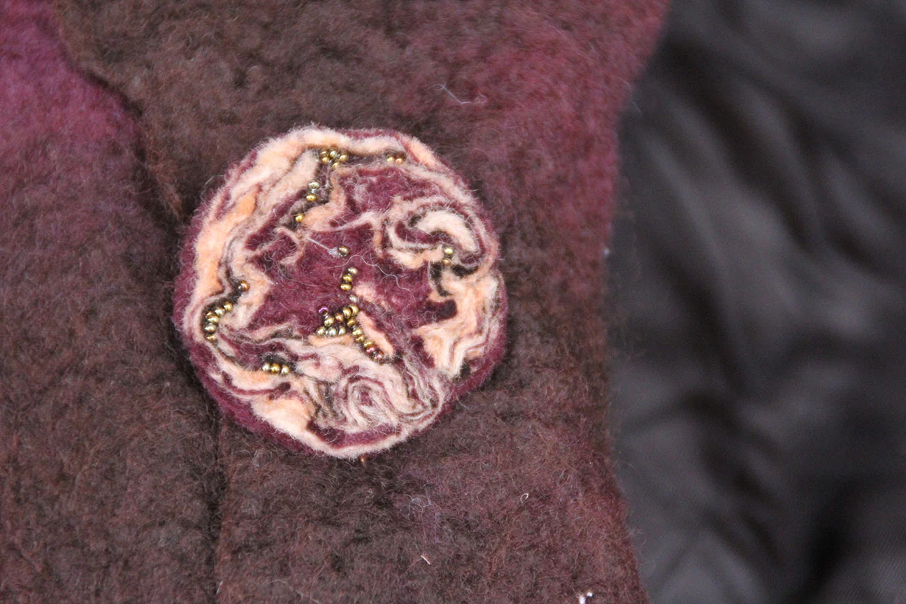 Felt stick pin. Wet felted and bead appliquéd.