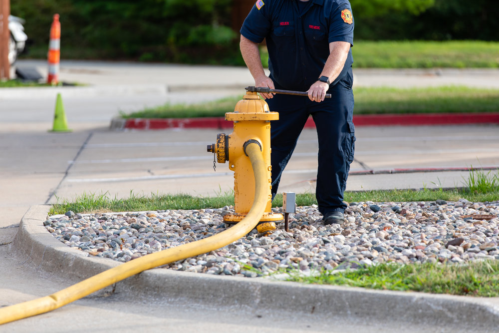 1H8A9335_firefighter hydrant hose.jpg