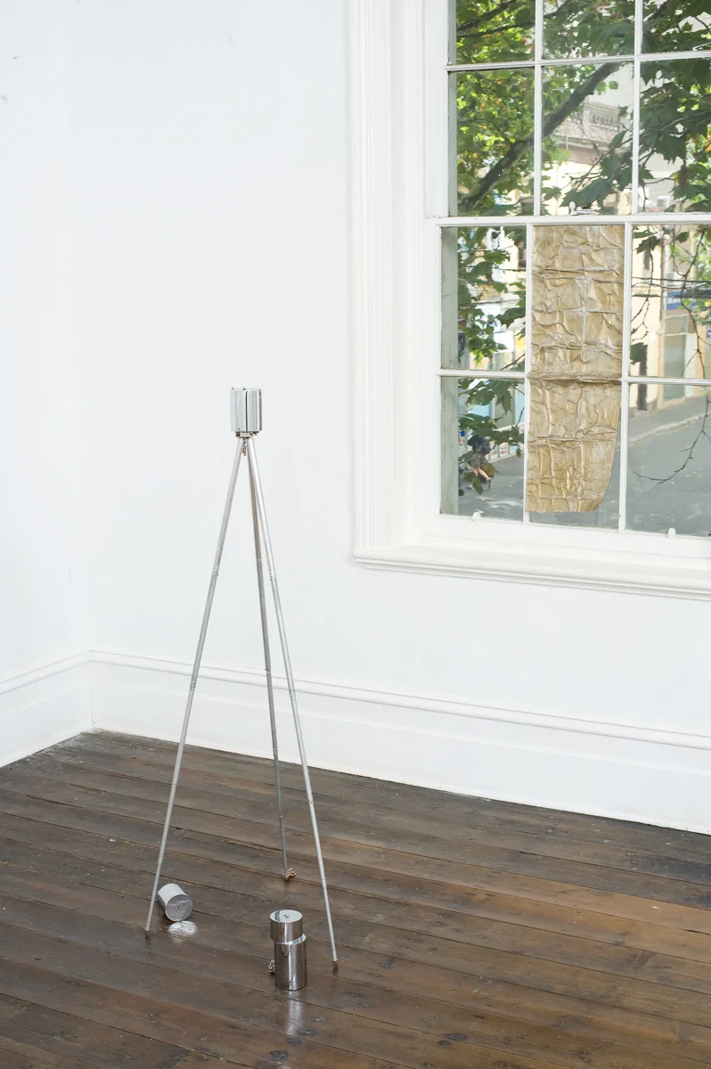 (left) Cover Version 2011 chromed steel, neodymium magnets, carbon steel ball bearings, aluminum tripod (right) Blind Mime 2011 primed copper, gold pencil
