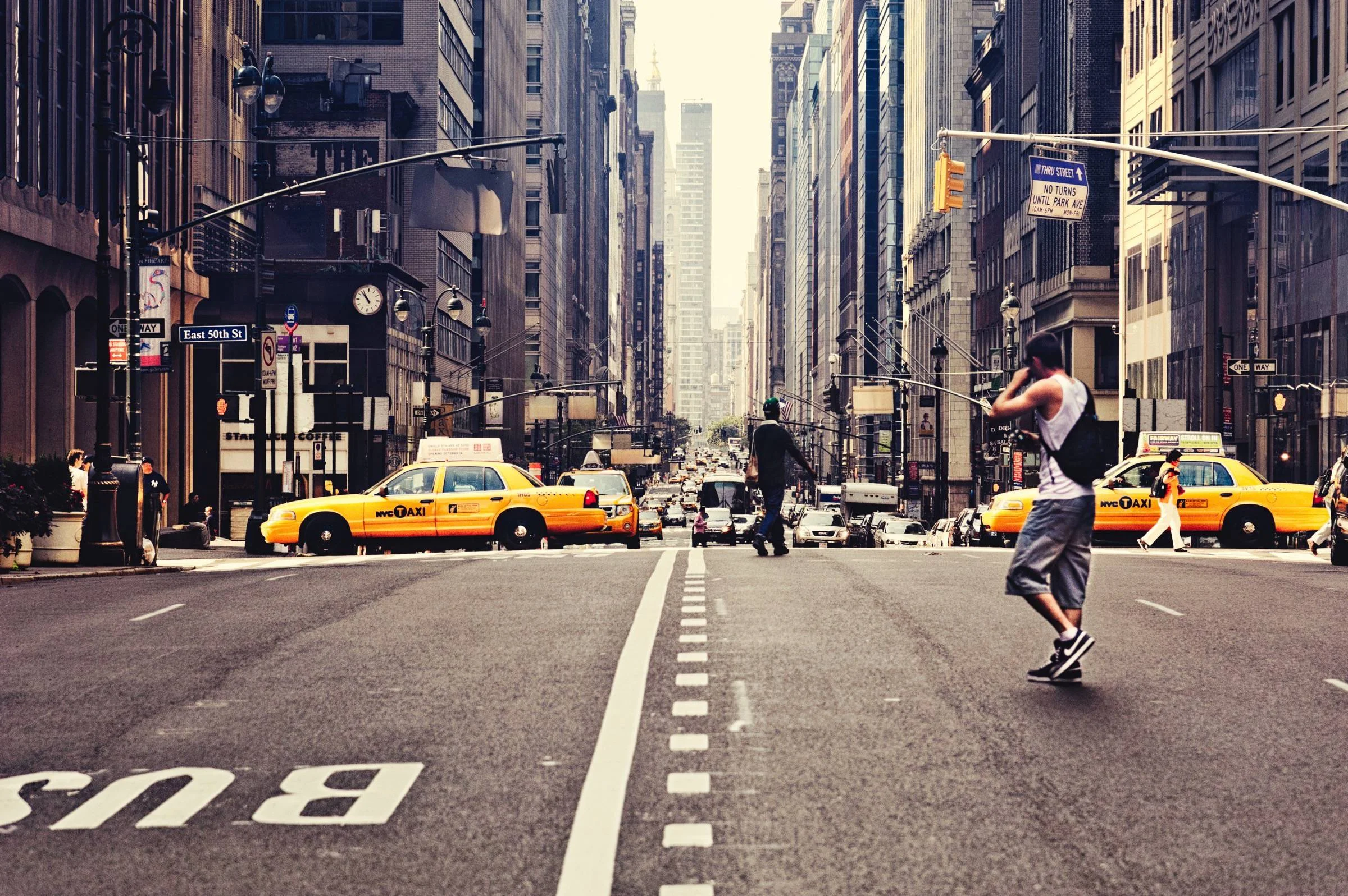 Guy Crossing Street in New York