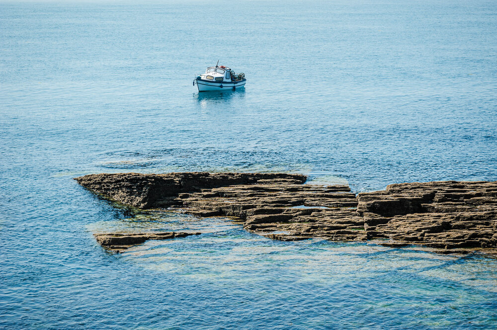  A Lobster Fisherman off the coast of Hook Head in the clear blue water
