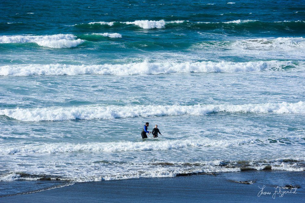 people in the water at Fanore Beach, Co. clare, Ireland