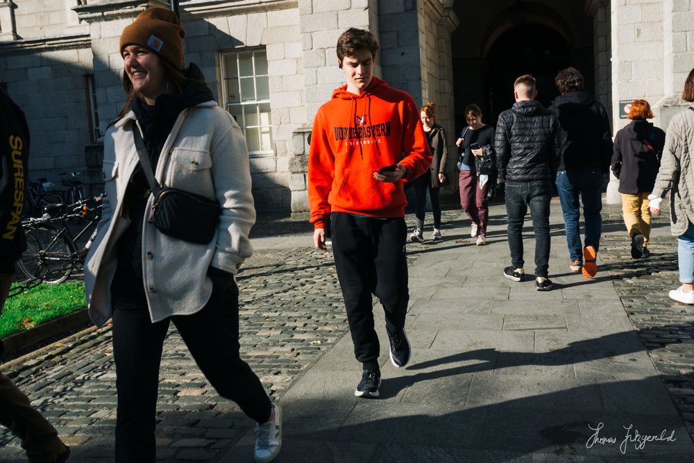 Red Sweatshirt Standing out against the Grey