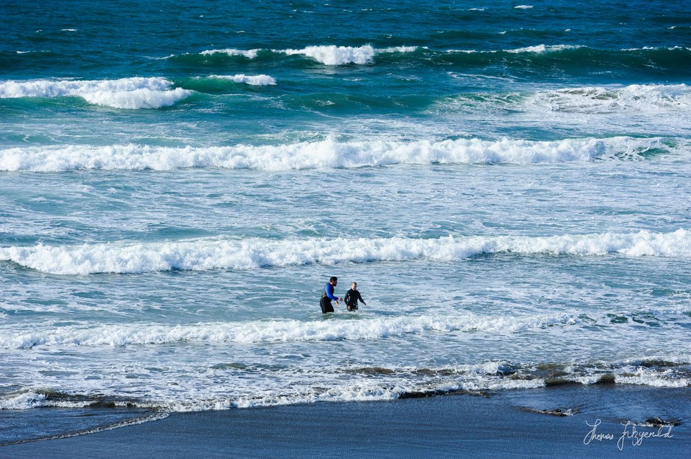 people in the water at Fanore Beach, Co. clare, Ireland