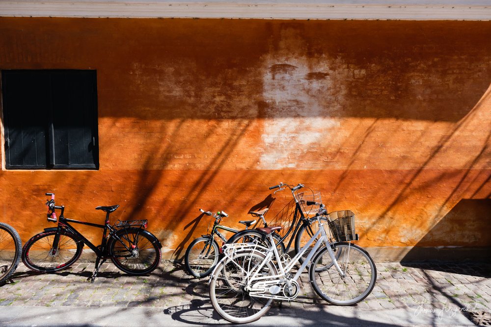 Bikes in front of a Red wall