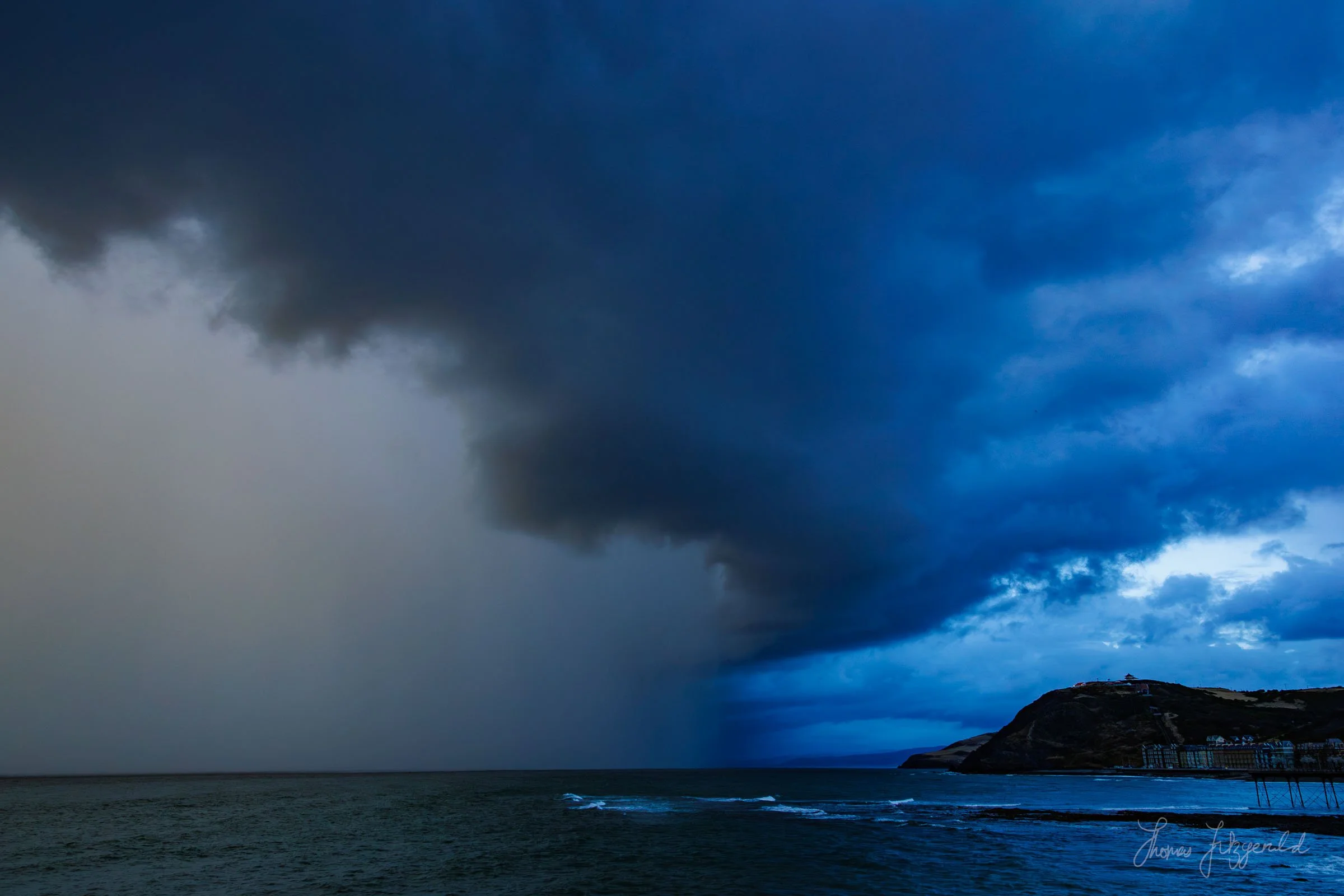 A massive dounpour rolls in with some dramatic storm clouds overhead