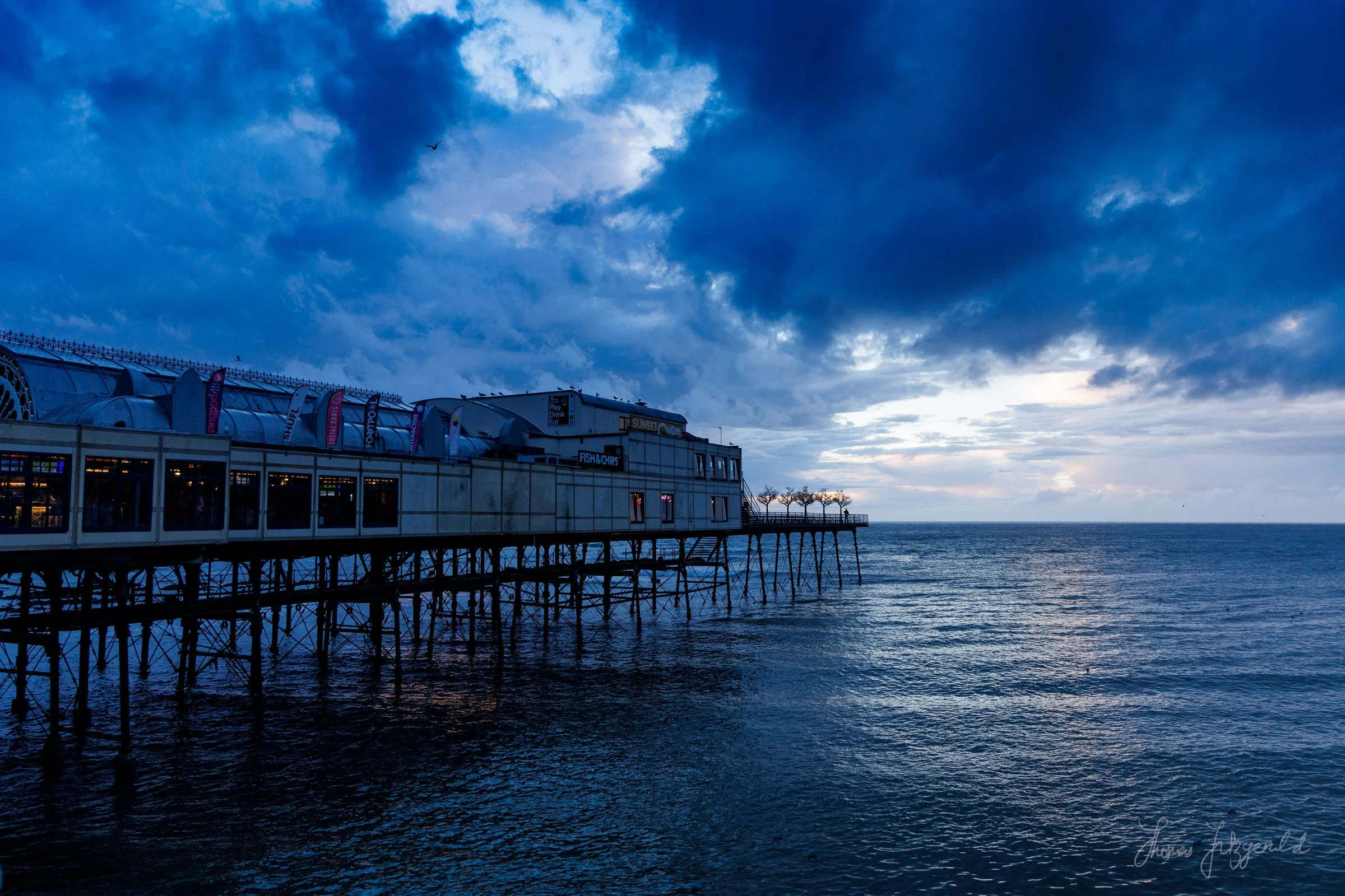 The Aberystwyth pier against the dramatic evening sky