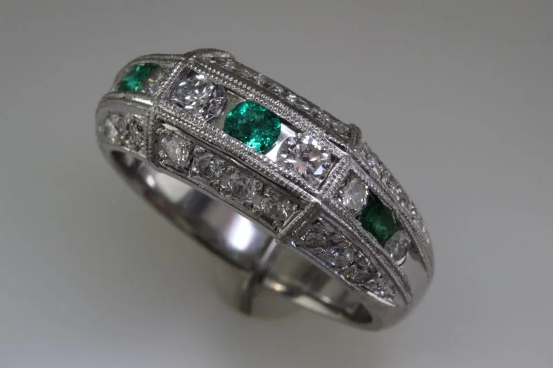 Platinum emerald and diamond ring