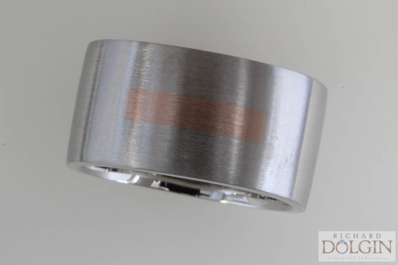 Platinum wedding band with inlaid rose gold