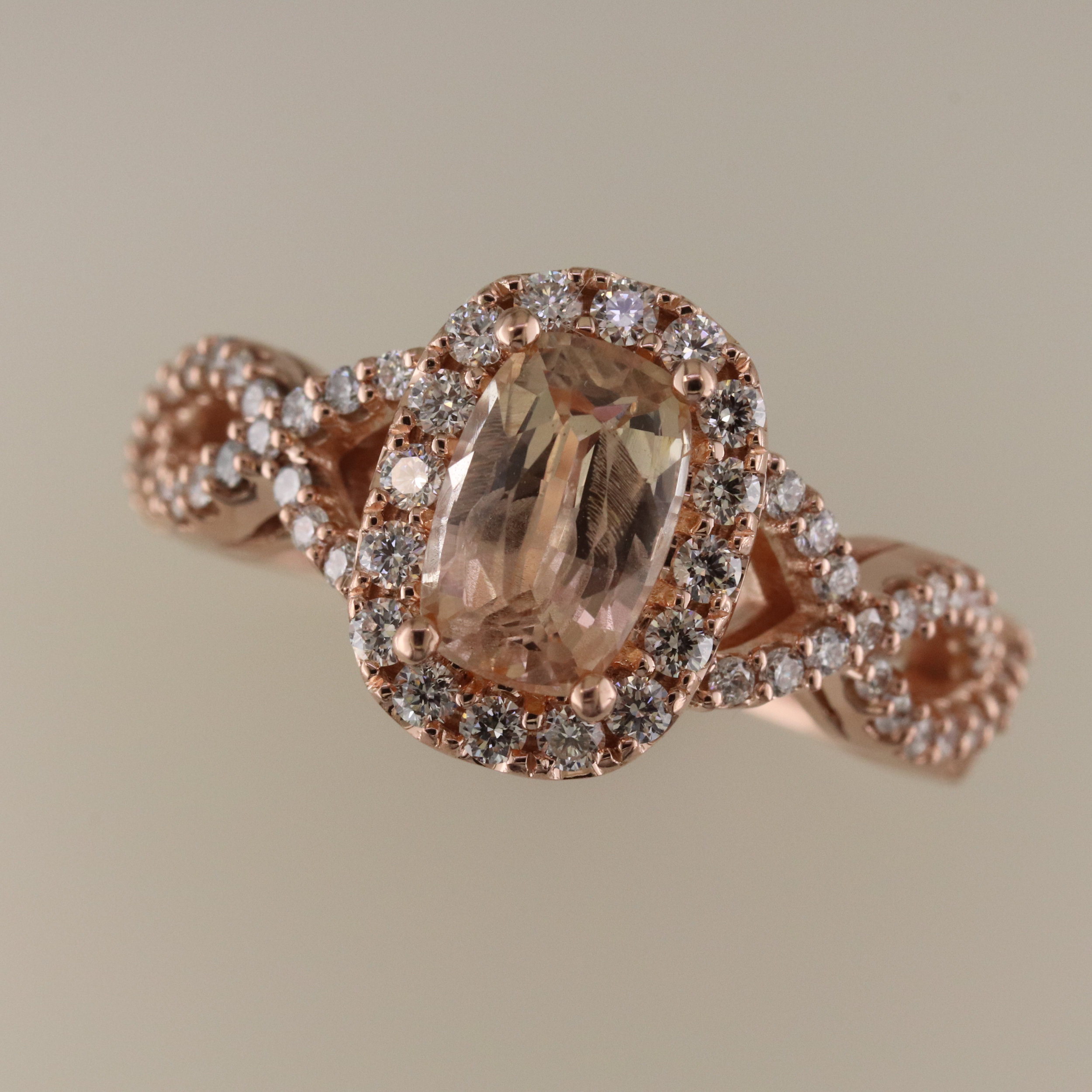 Peach sapphire and diamond ring