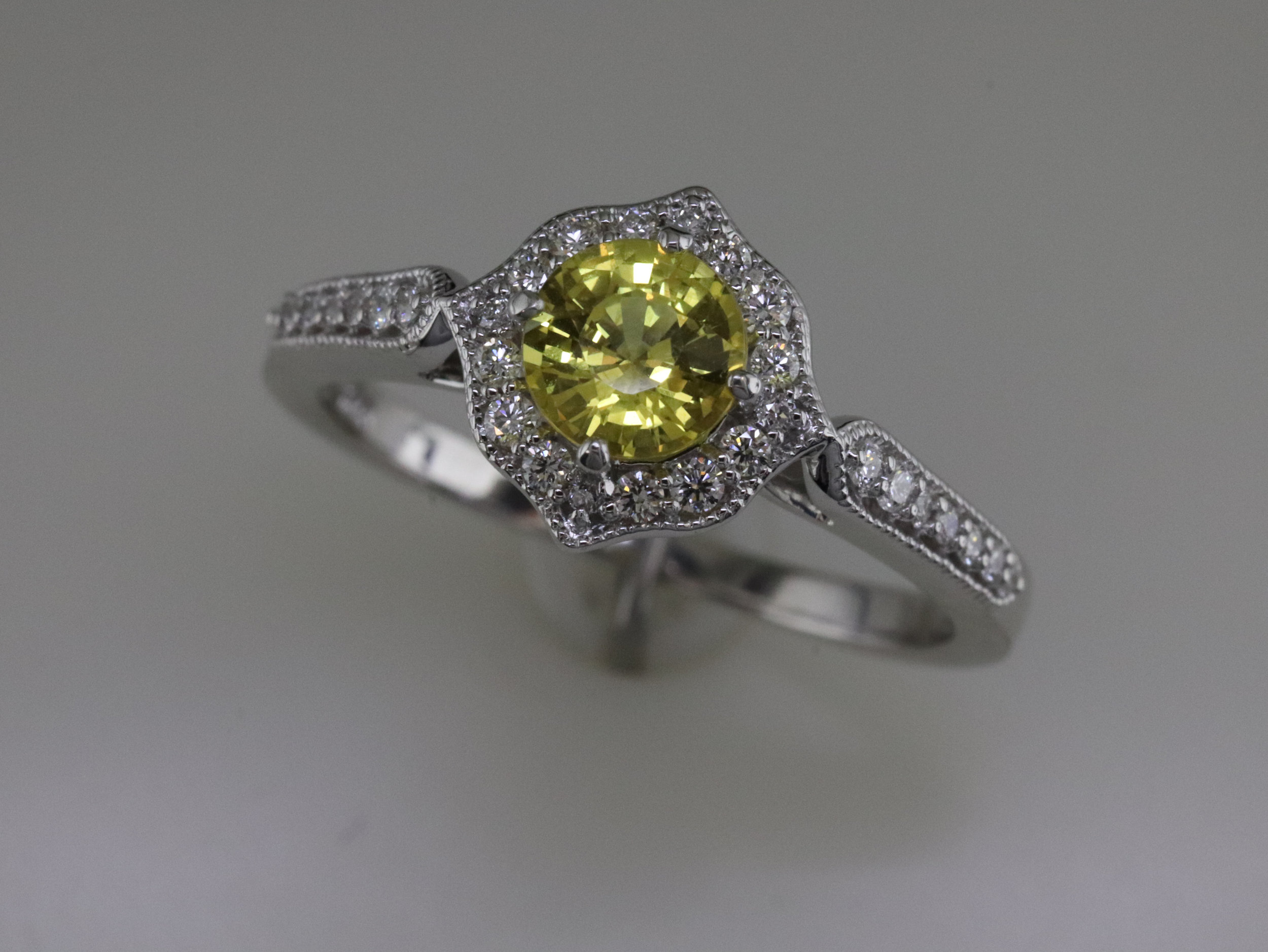 Yellow sapphire and diamond ring
