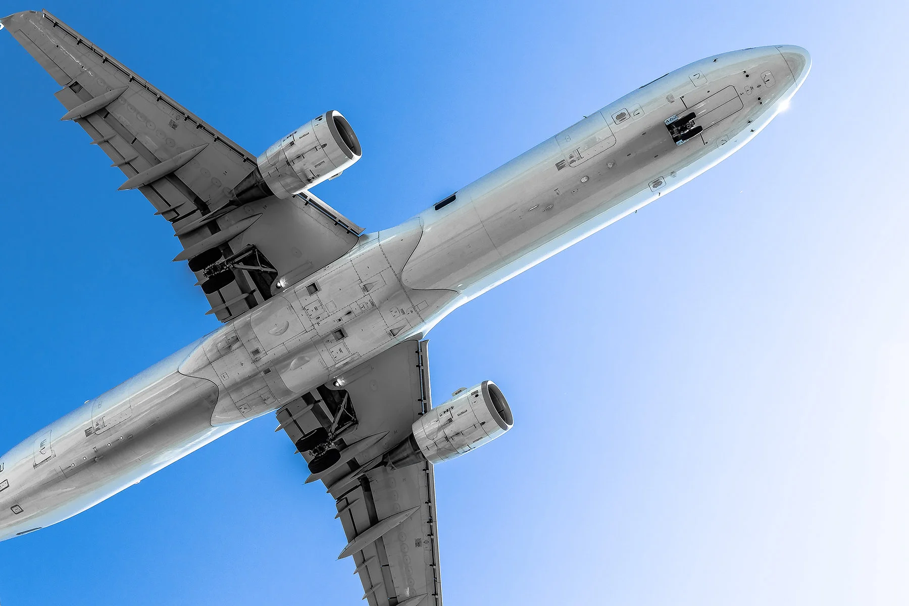 Daniel Camer Airplane Landing Bottom View Clear Blue Sky-.jpg