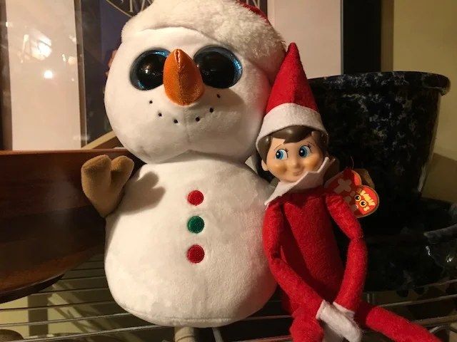 Shawn Anderson Elf with snowman.jpg